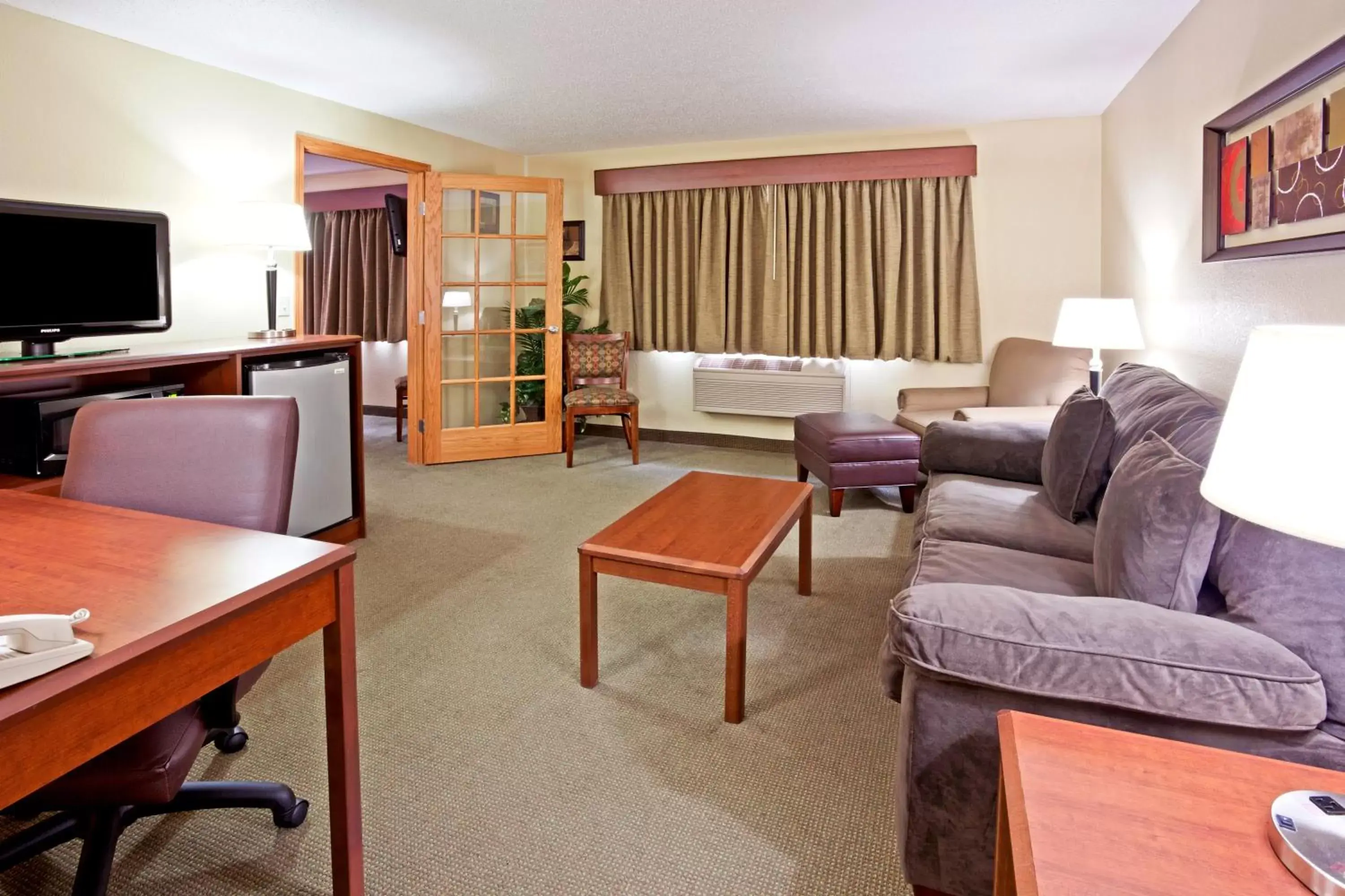 Living room, Seating Area in AmericInn by Wyndham Fargo West Acres