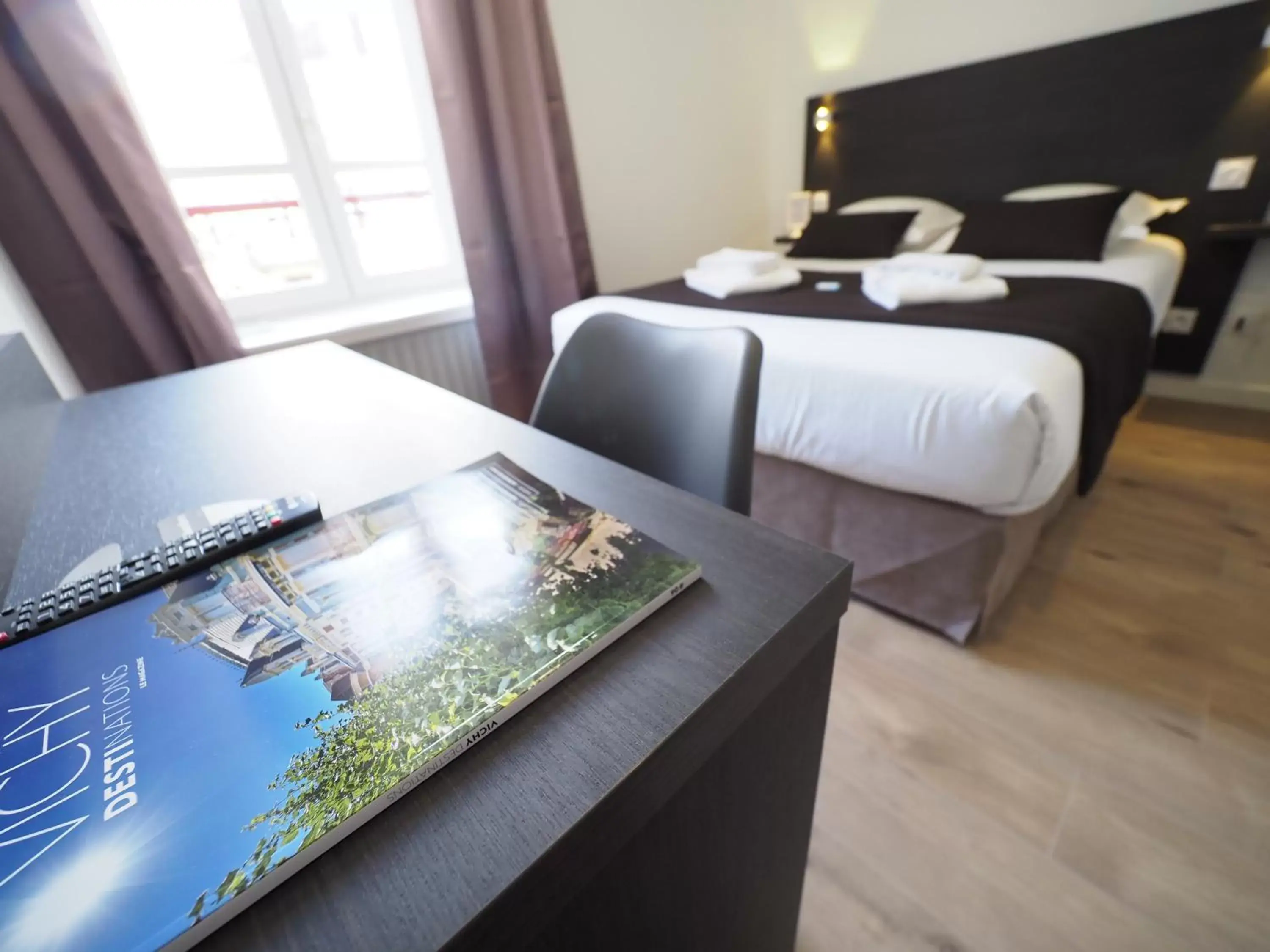 Photo of the whole room, Bed in Hôtel Le Biarritz - Vichy