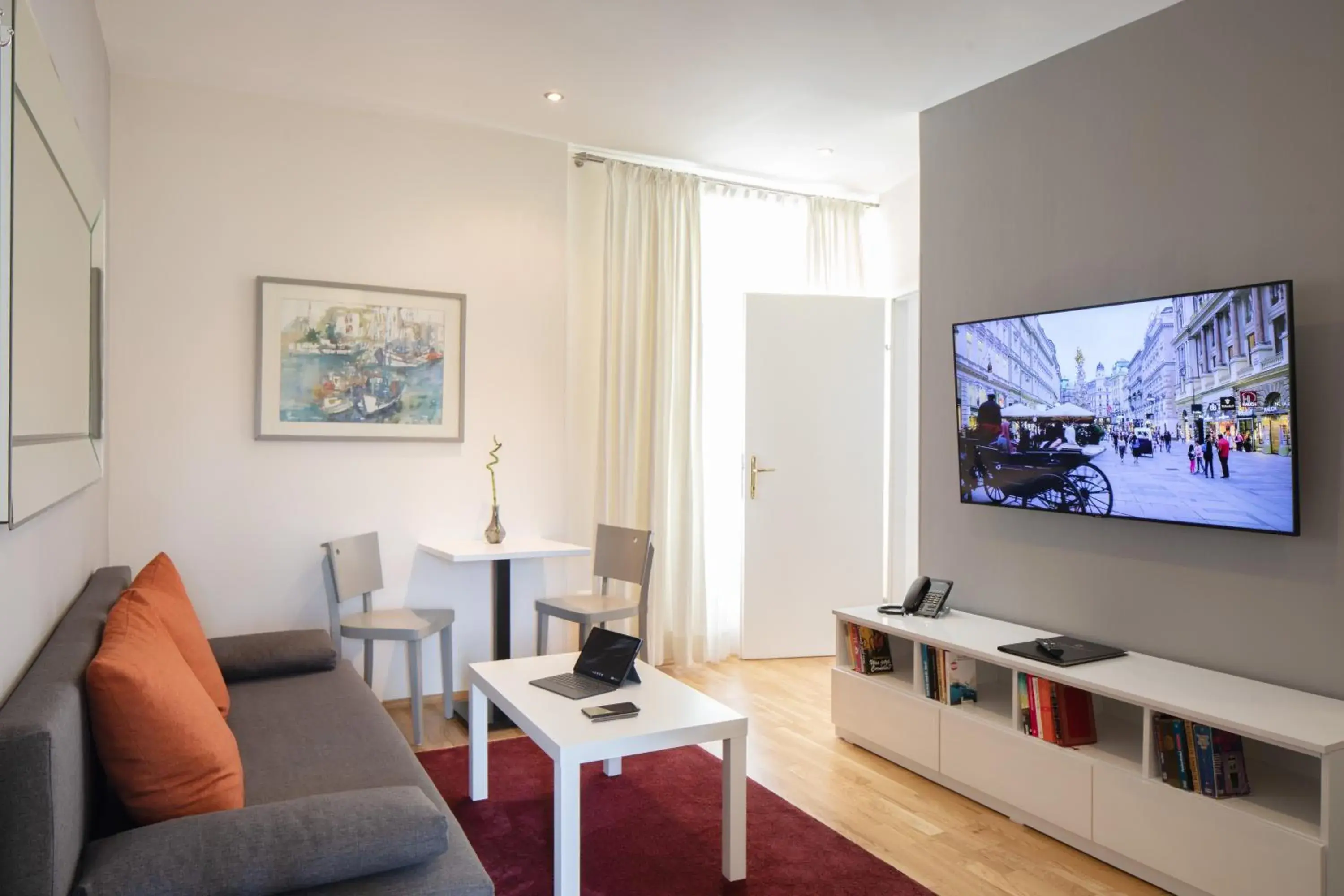 Living room, TV/Entertainment Center in The Levante Rathaus Apartments