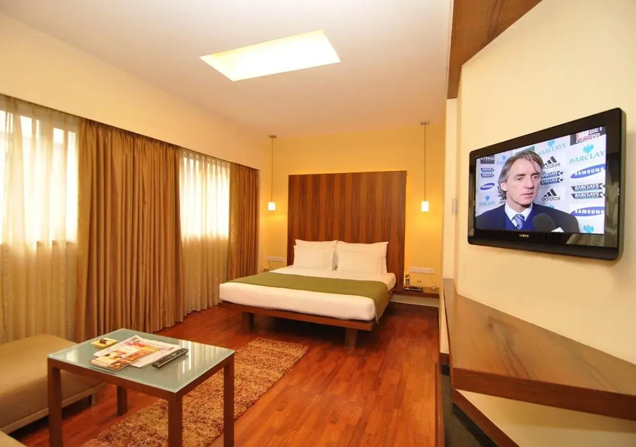 Bed, TV/Entertainment Center in Hotel Studio Estique