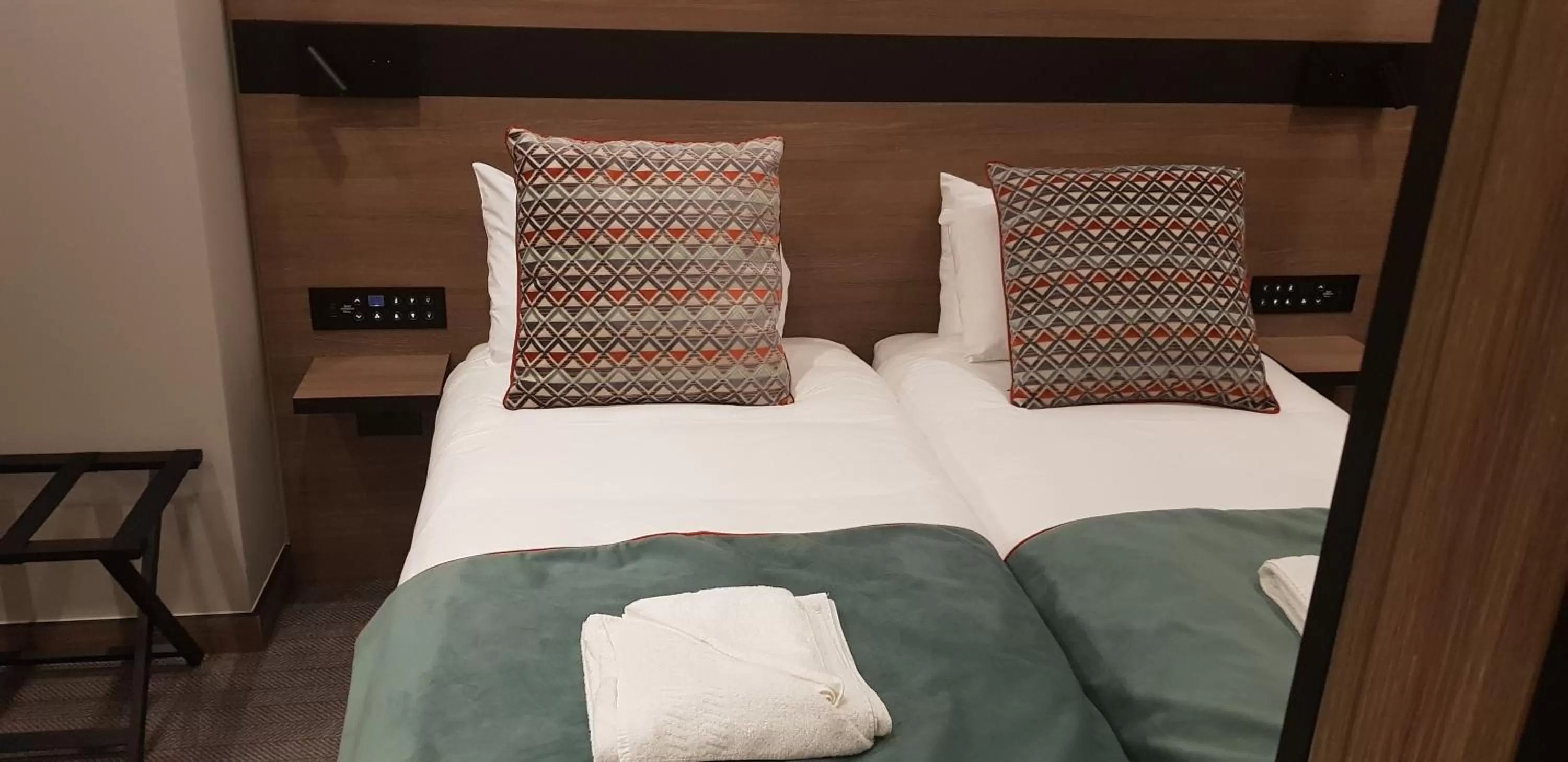 Bed in Merit Kensington Hotel