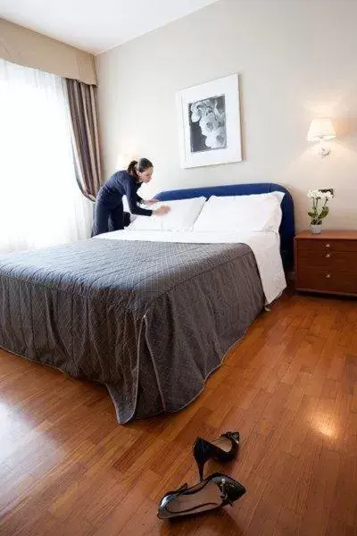 Bed in Cosmo Hotel Torri