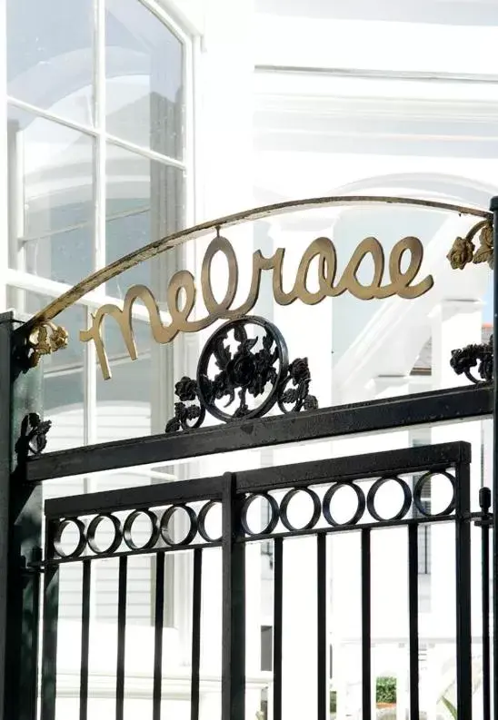 Property logo or sign in Melrose Mansion Suites