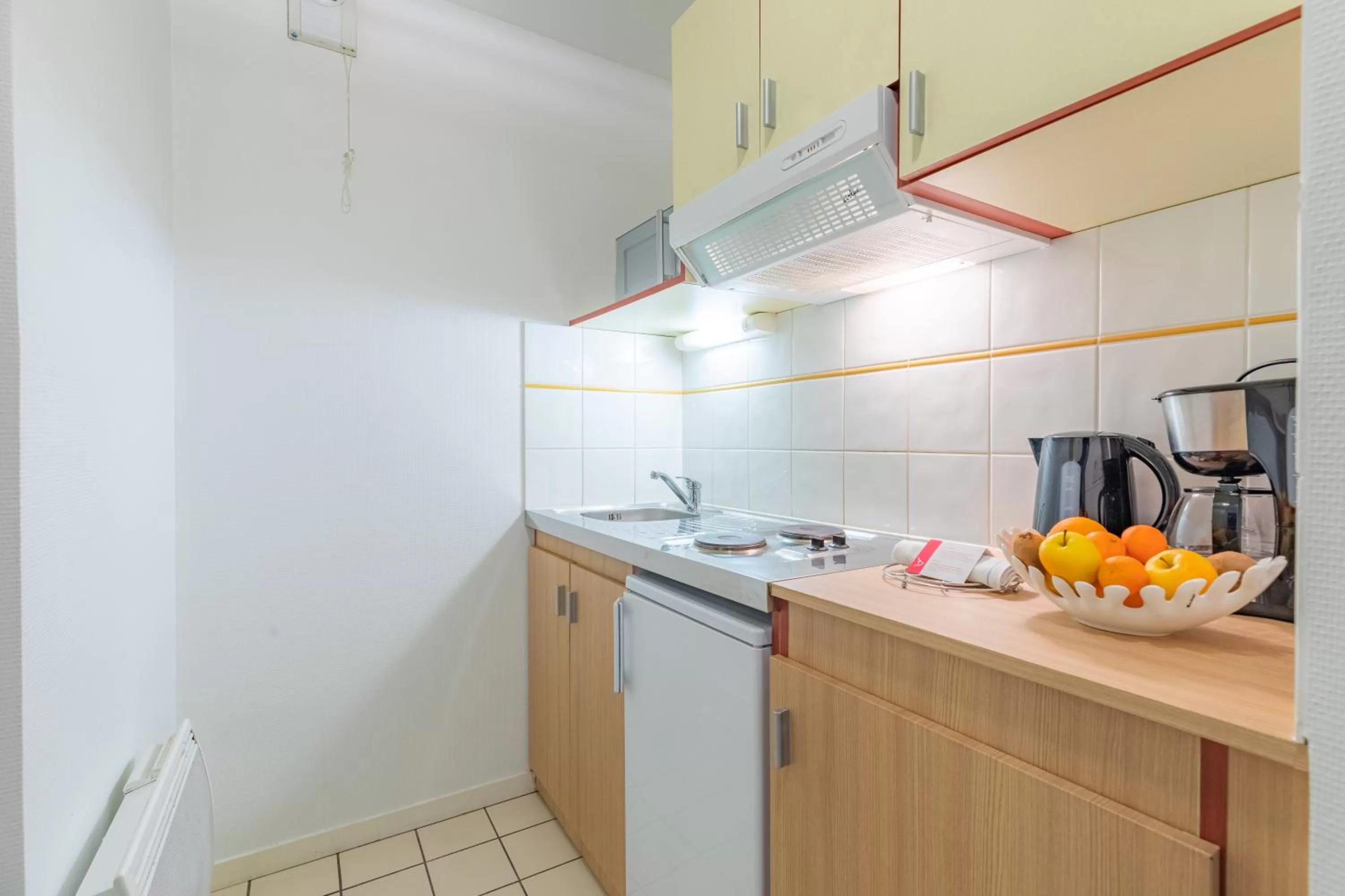 Kitchen or kitchenette in Appart'City Classic Caen