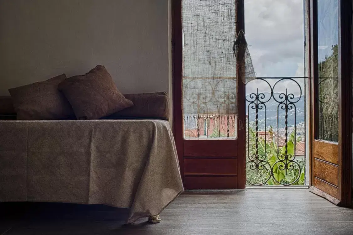 Bed, Seating Area in B.E.A. Maison