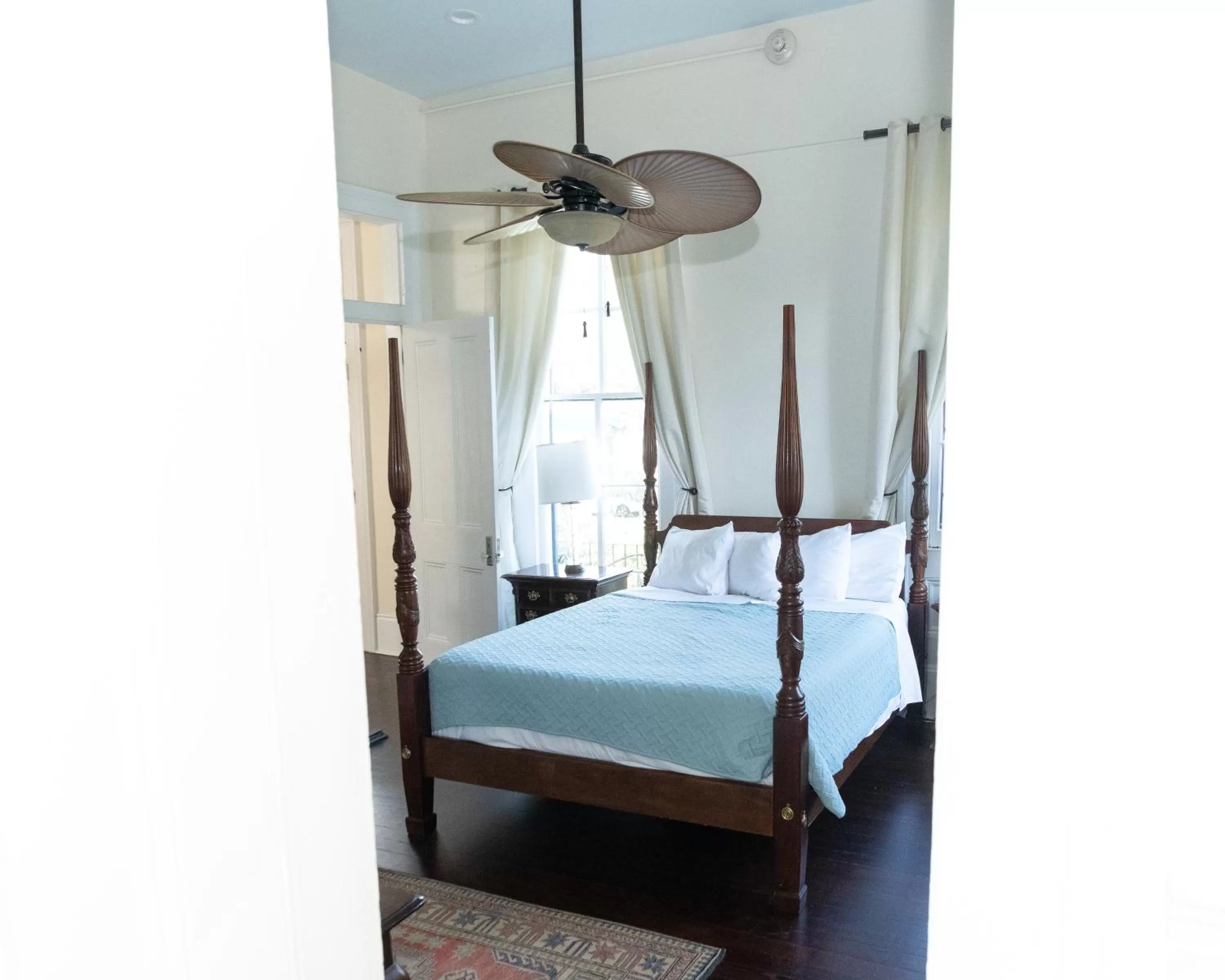 Bed in The Esplanade Guesthouse Mansion