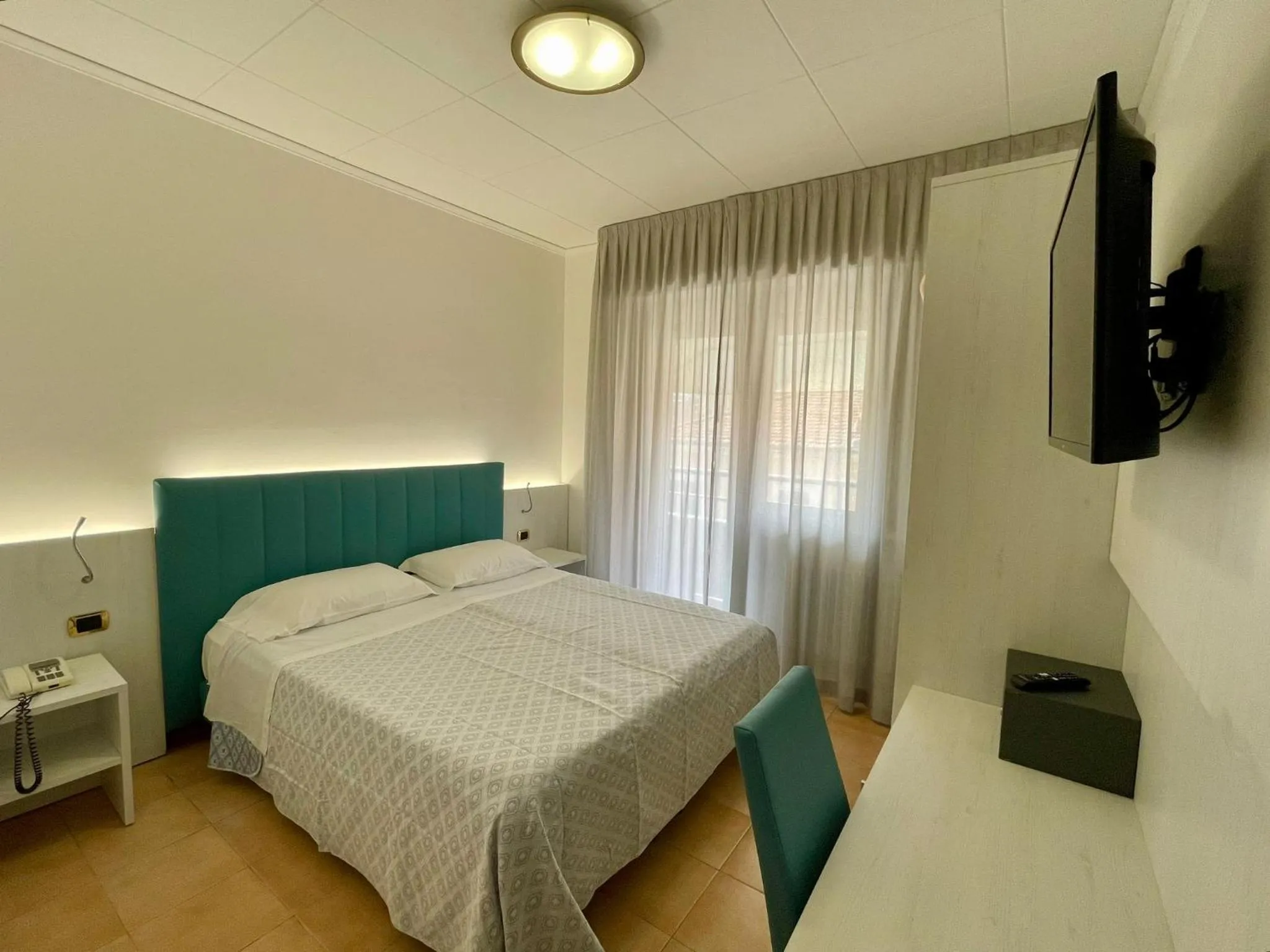 Bed in Hotel Corallo