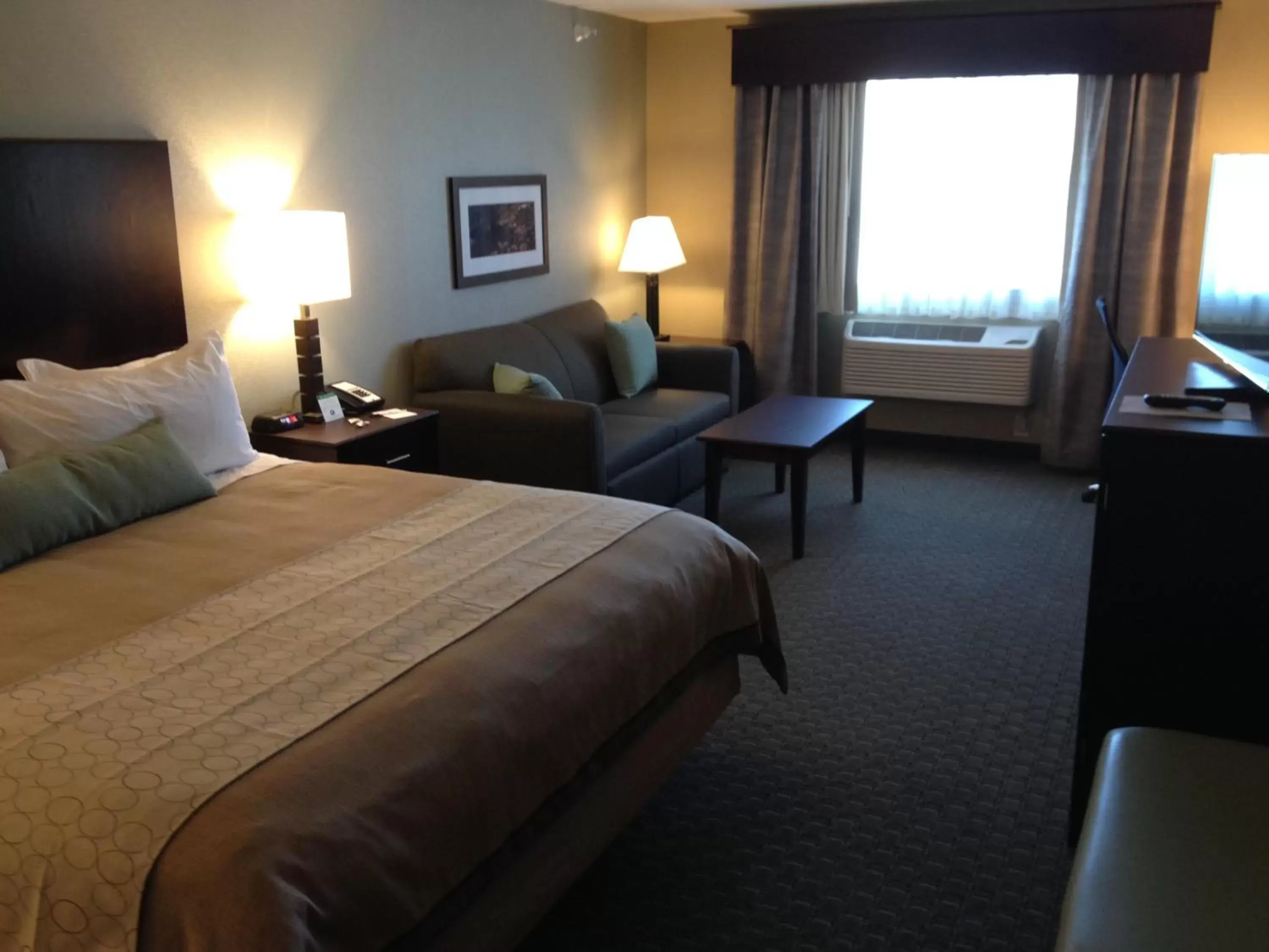 Bed in GrandStay Hotel & Suites - Glenwood