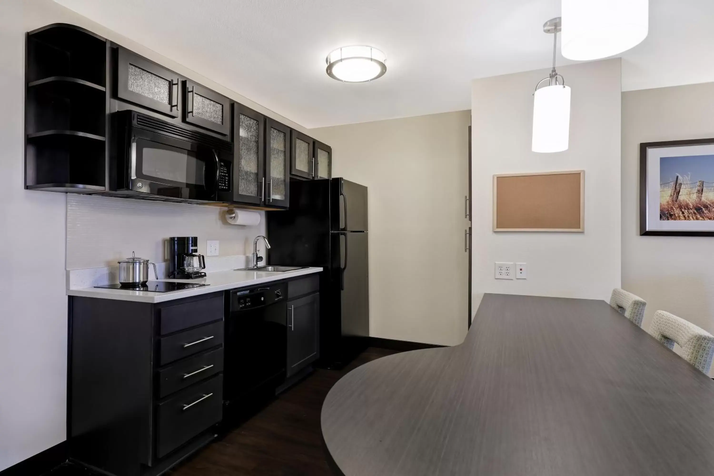 Photo of the whole room, Kitchen/Kitchenette in Candlewood Suites Indianapolis - South, an IHG Hotel