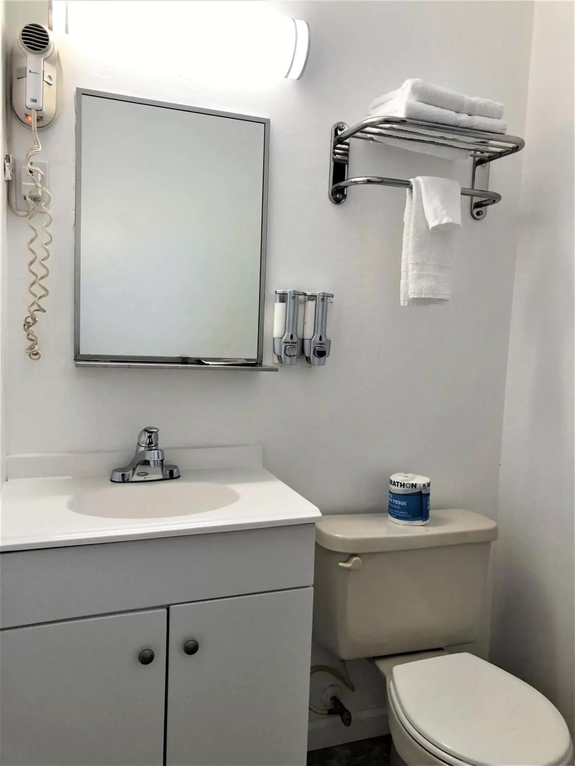 Toilet, Bathroom in Blue Coast Inn & Suites