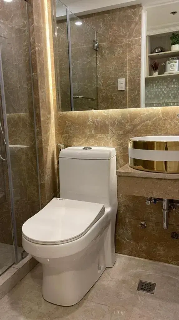 Toilet, Bathroom in Mpt Suites