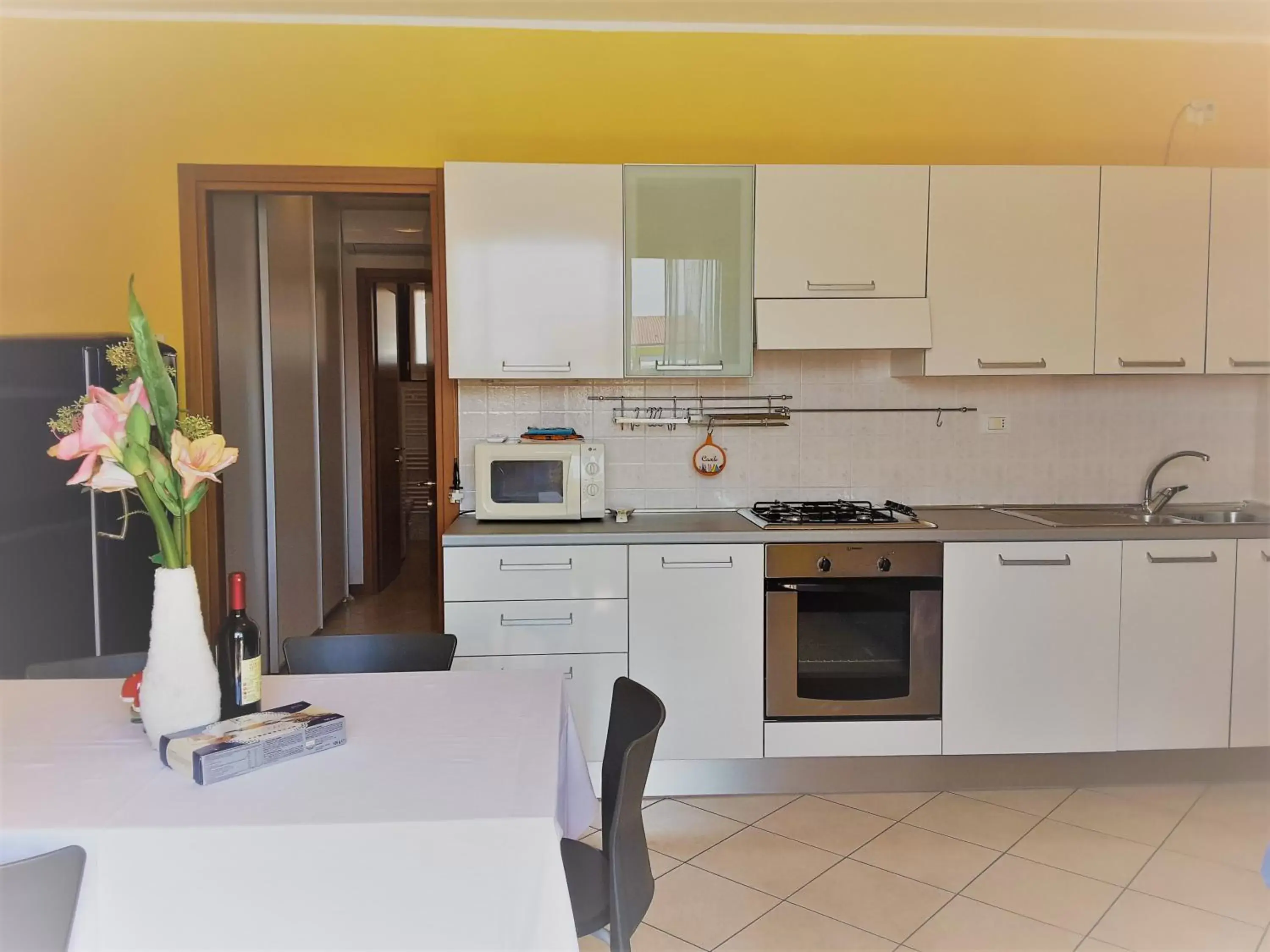 Kitchen/Kitchenette in Villaggio dei Fiori Apart- Hotel 3 Stars - Family Resort