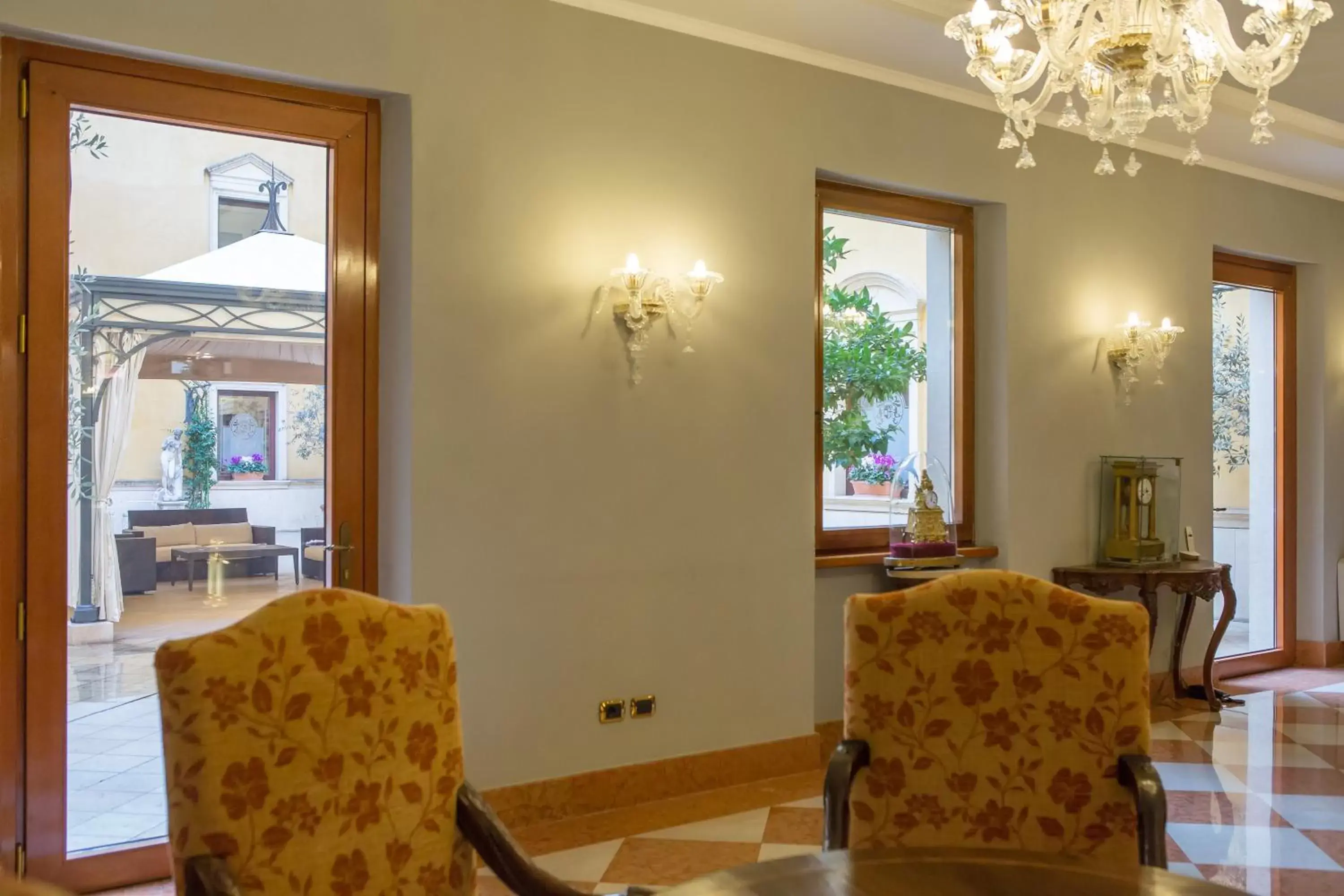 Communal lounge/ TV room, Dining Area in Due Torri Hotel