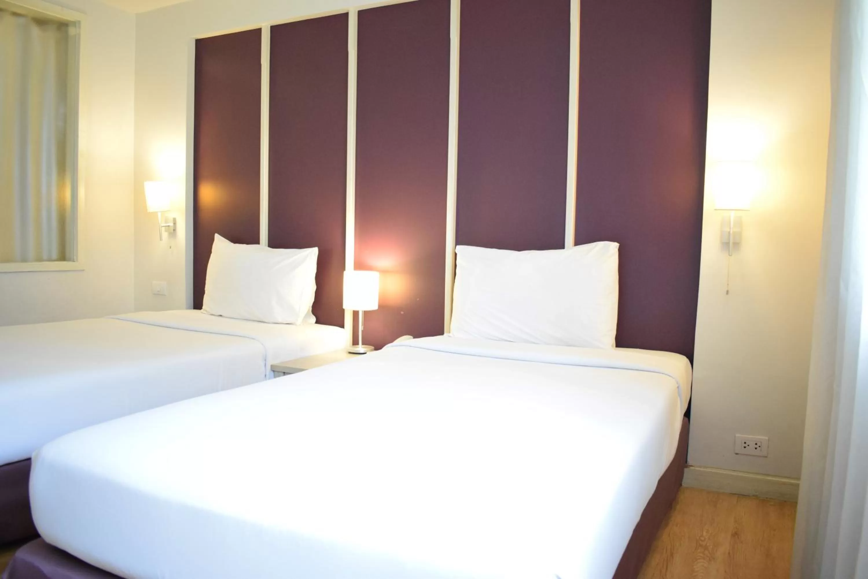 Bed in Trang Hotel Bangkok - SHA Plus