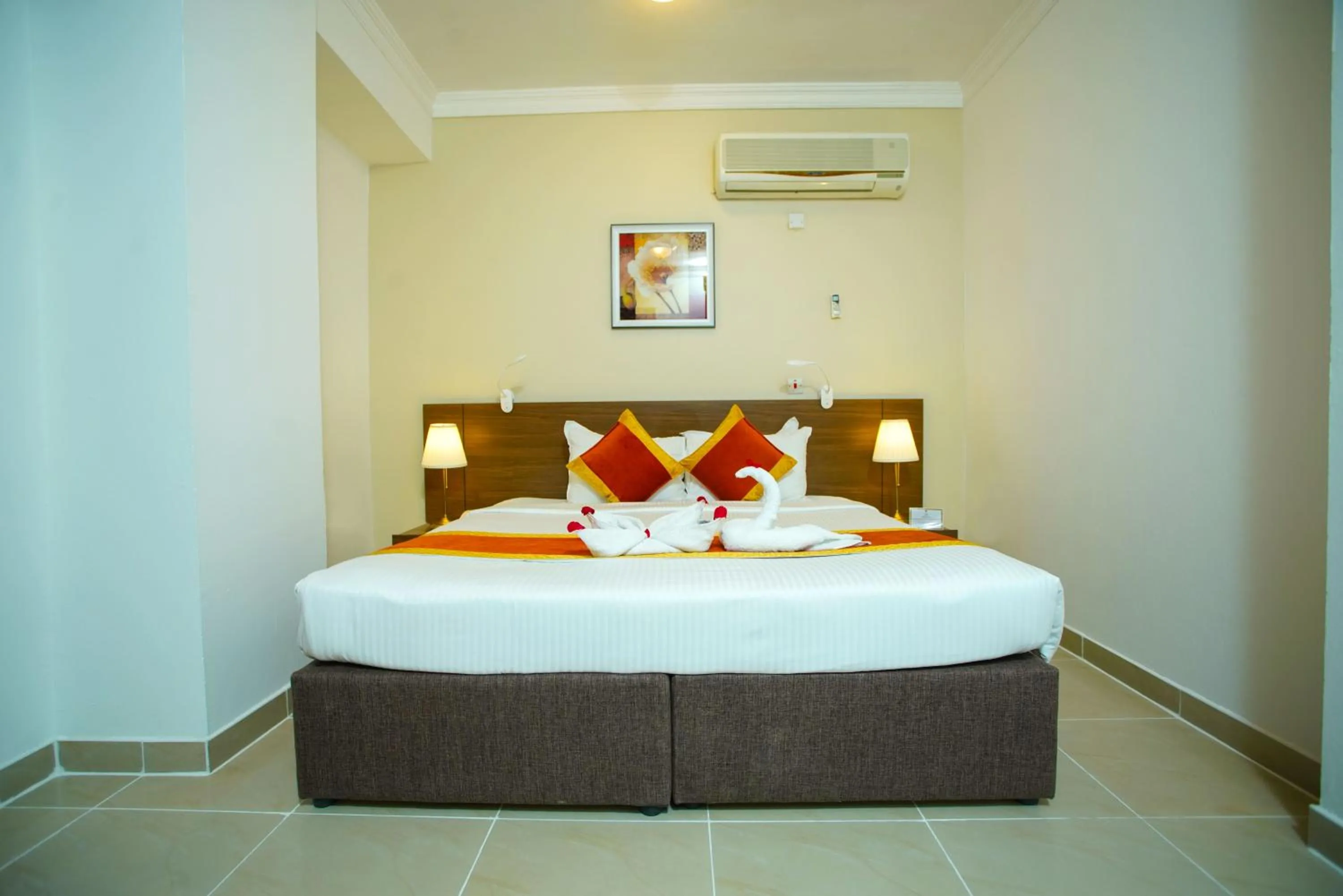 Bed in La Villa Inn Hotel Apartment