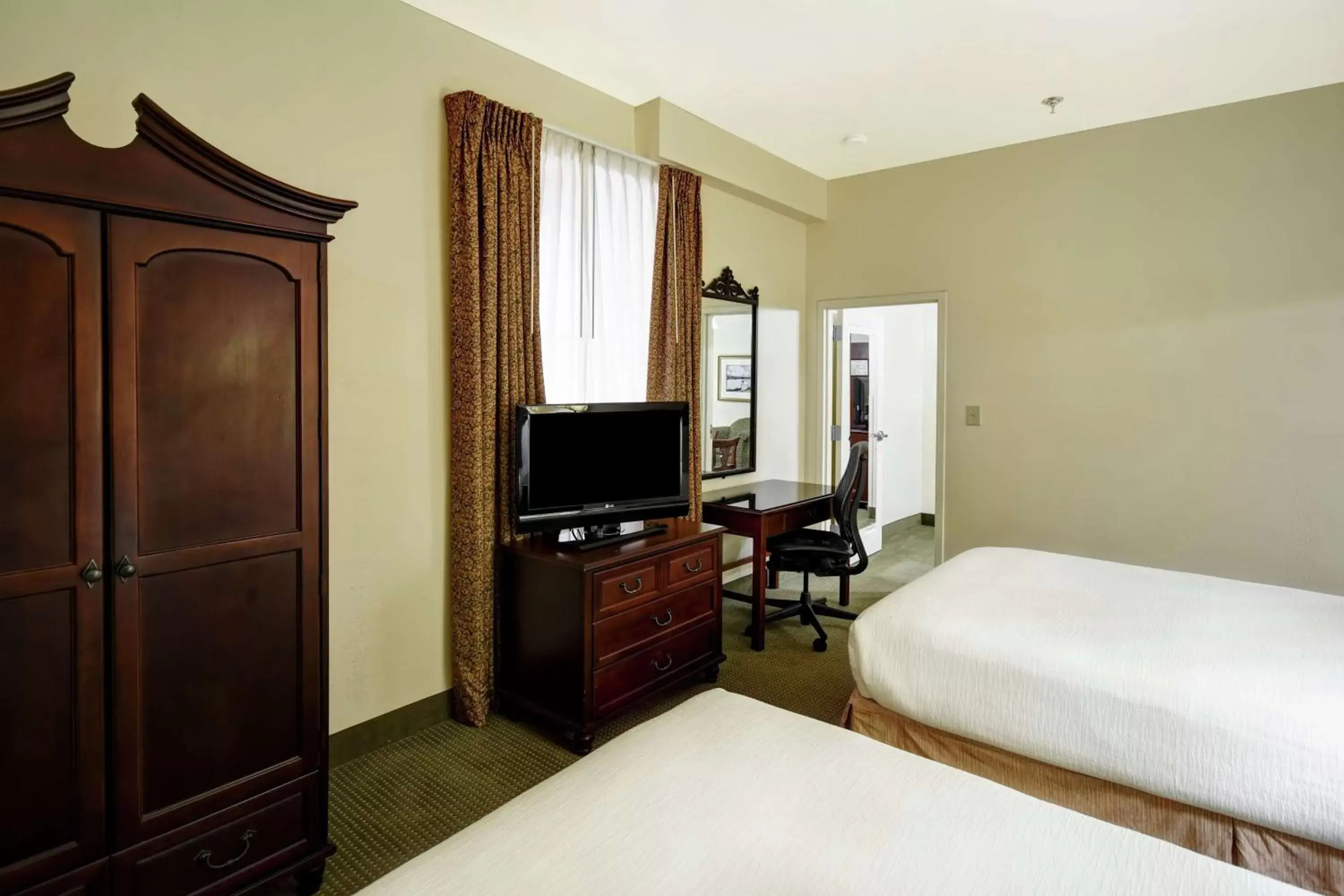Bedroom, TV/Entertainment Center in Embassy Suites Charleston - Historic District