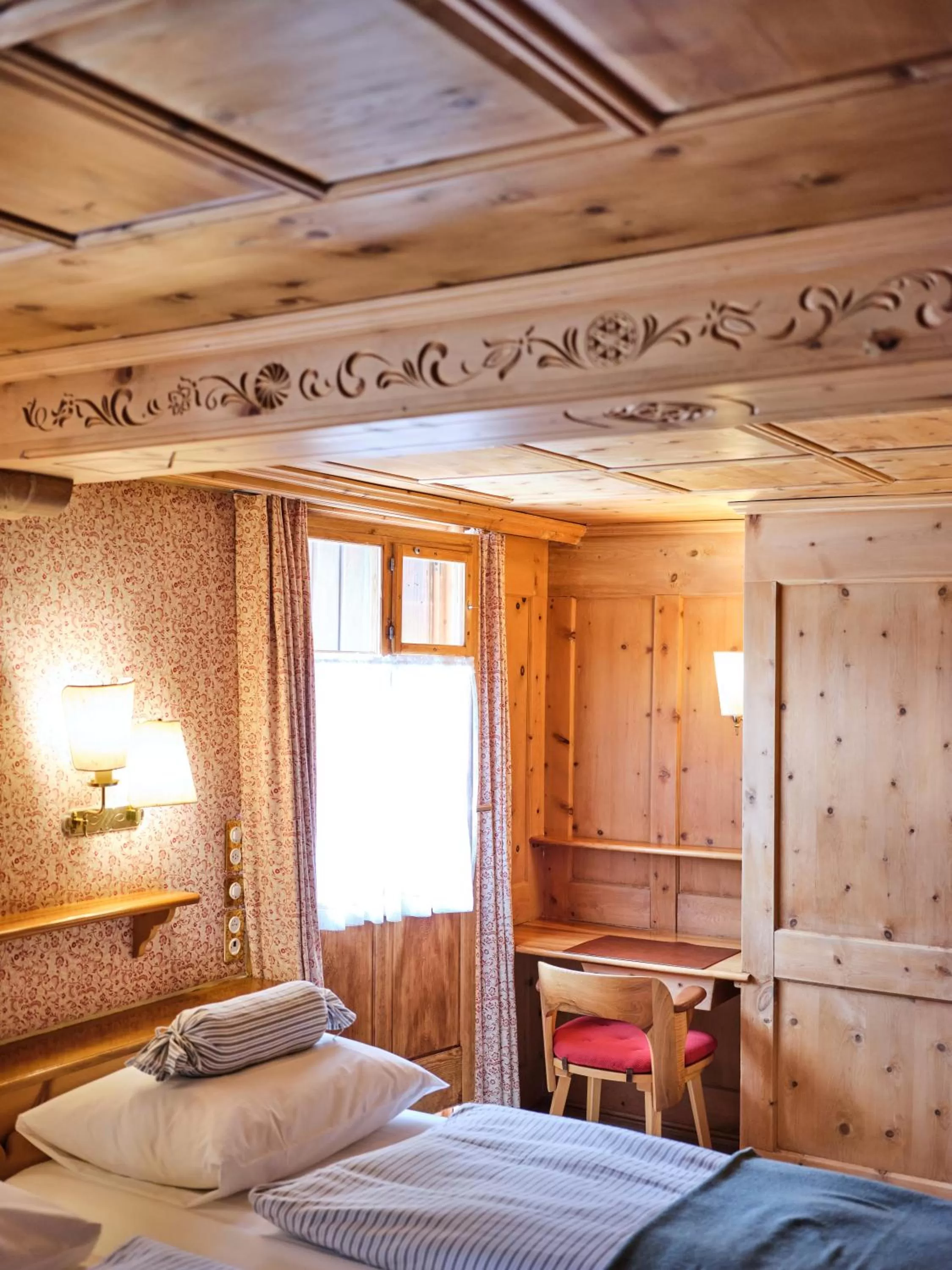 Photo of the whole room, Bed in Hotel Chesa Grischuna