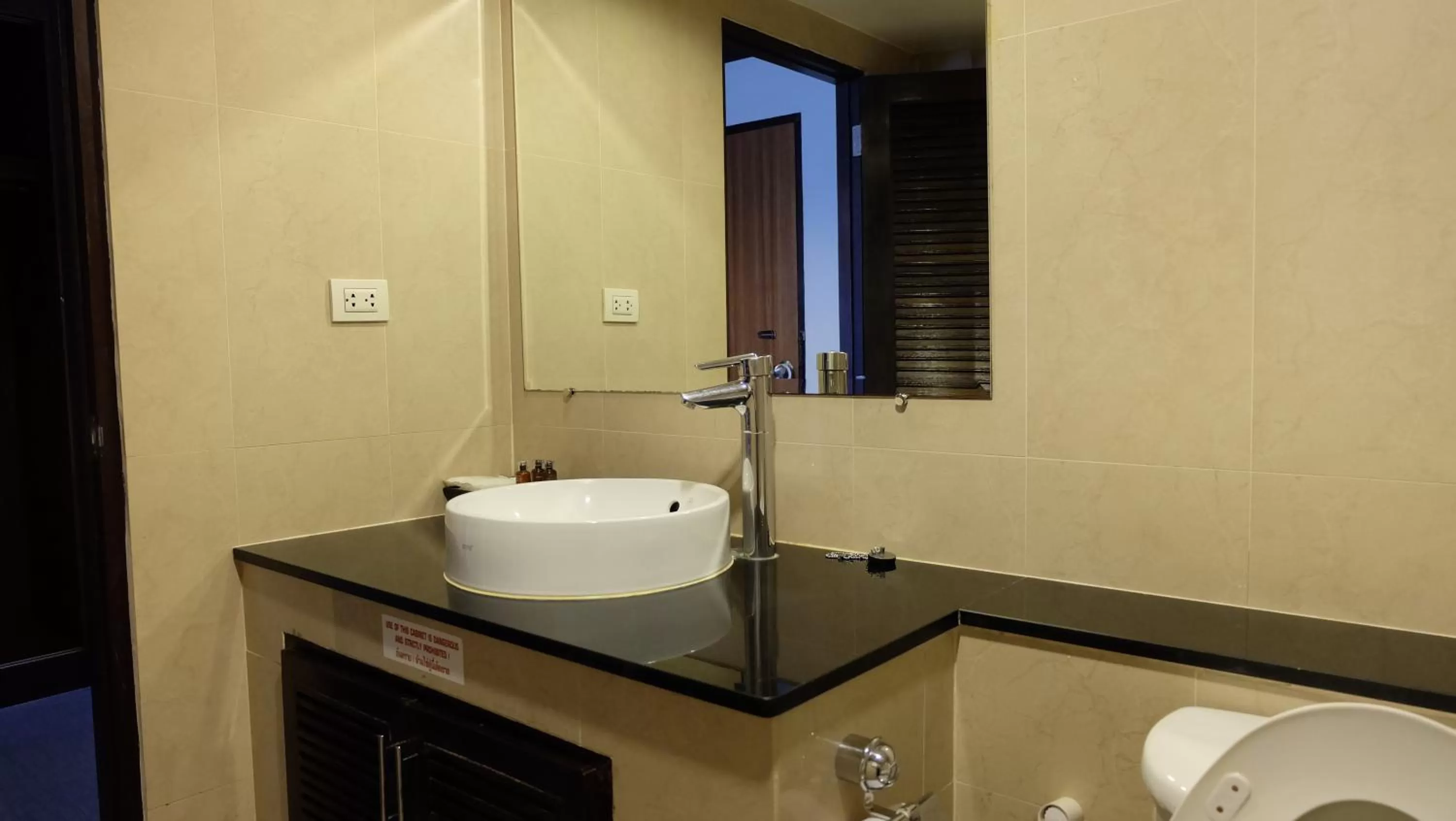 Toilet in Grand Business Inn