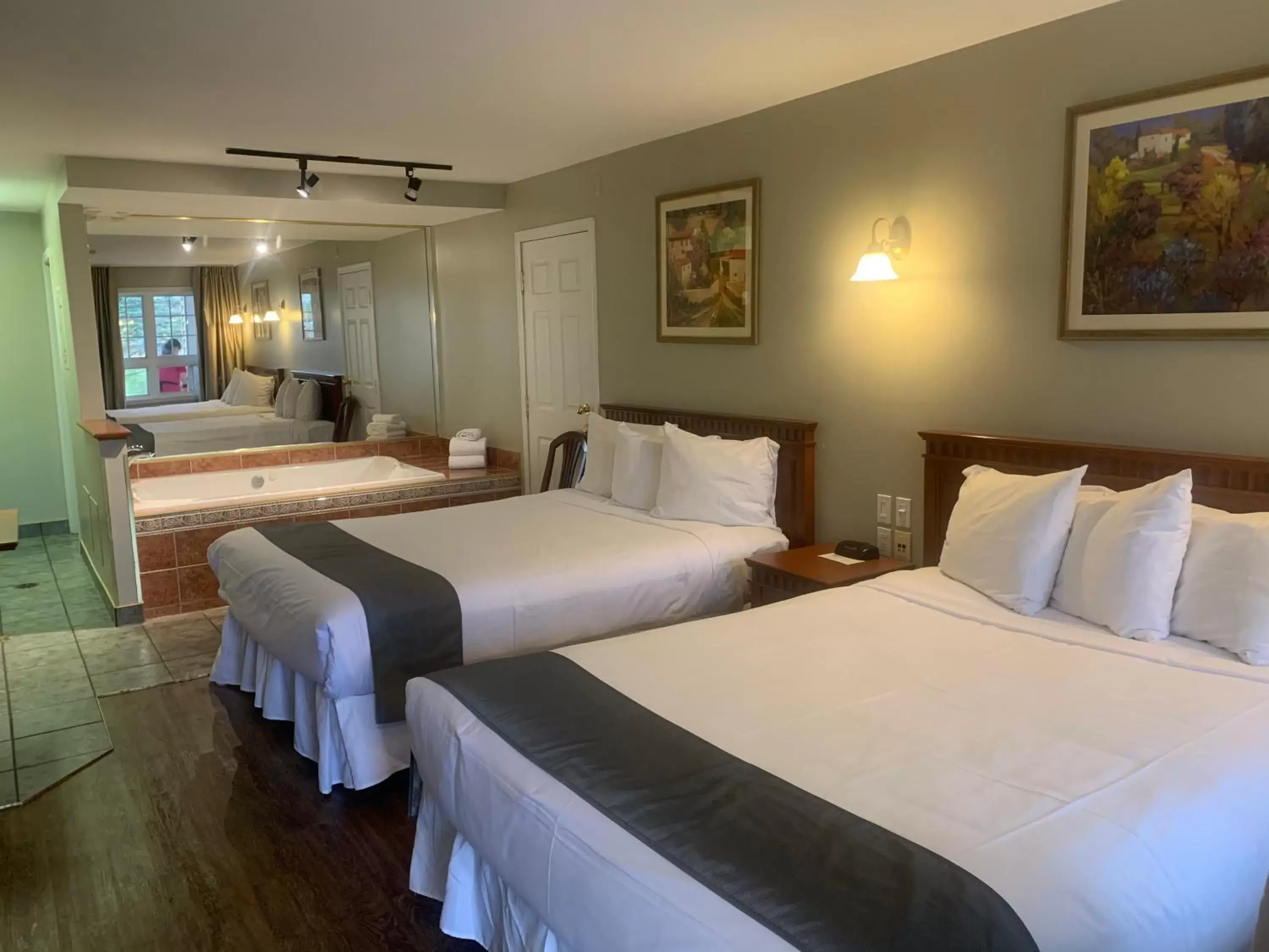 Bedroom, Bed in Hotel and Suites Les Laurentides
