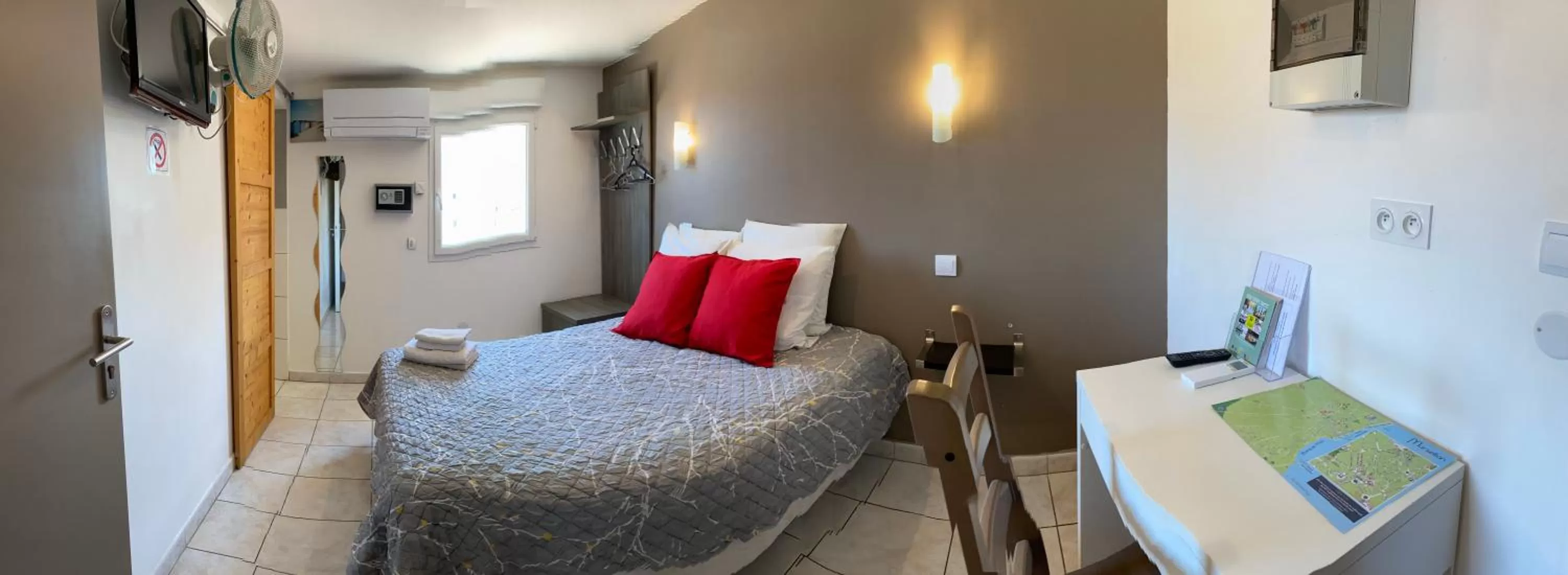 Bed in LOGIS Hôtel La Chaumière