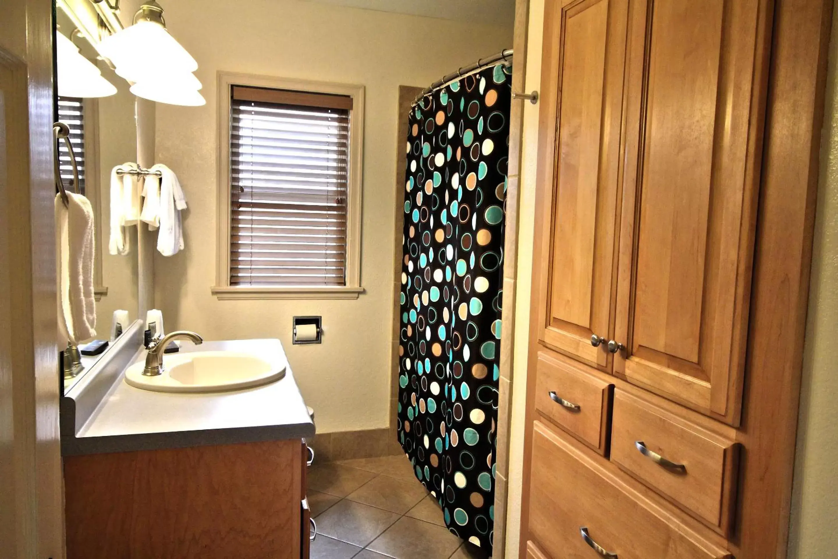Bathroom in Peach Tree Inn & Suites