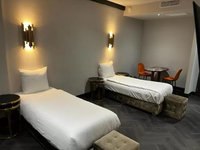 Photo of the whole room, Bed in Triple G Hotels
