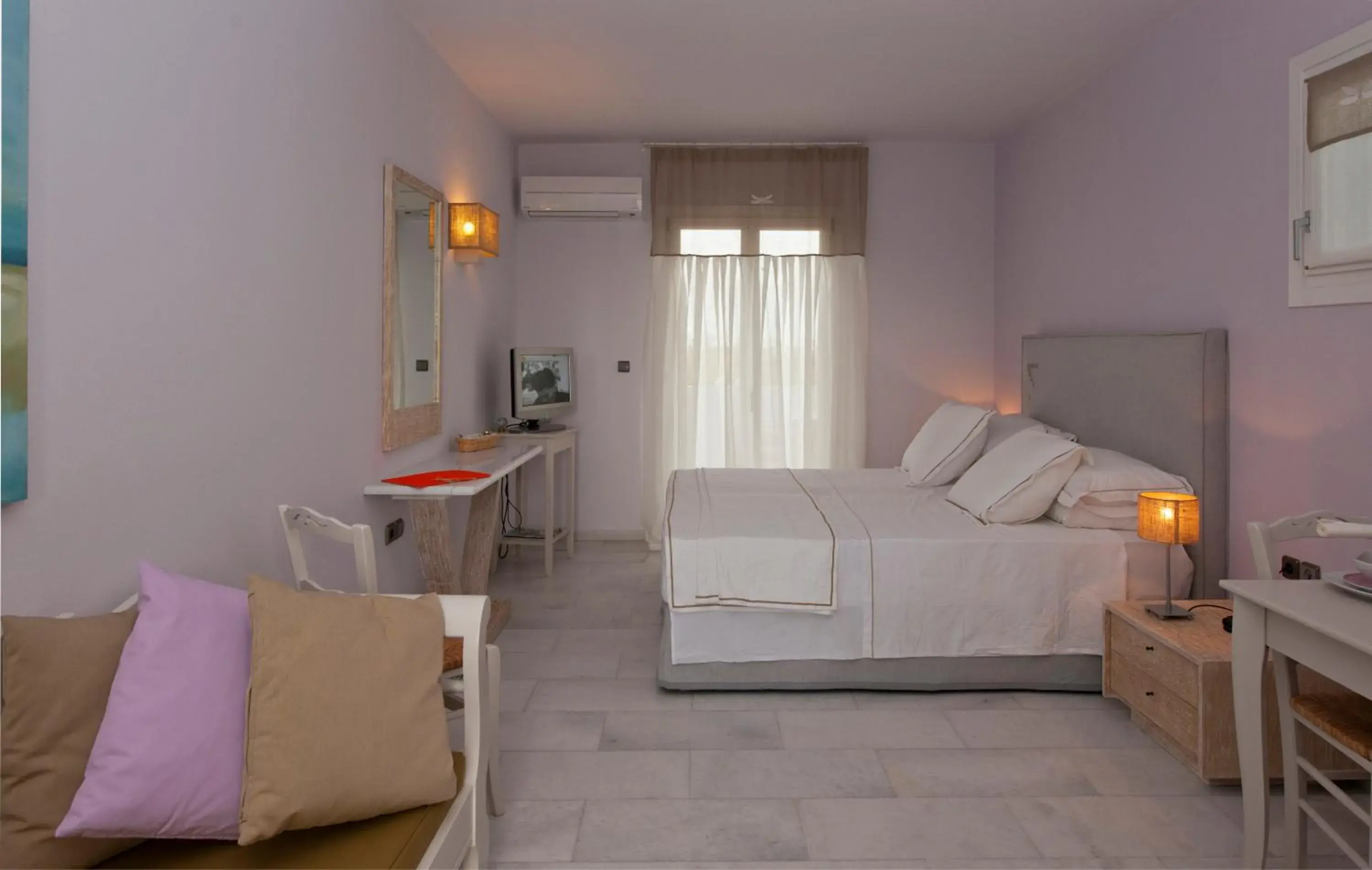 Photo of the whole room in Ammos Naxos Exclusive Apartment