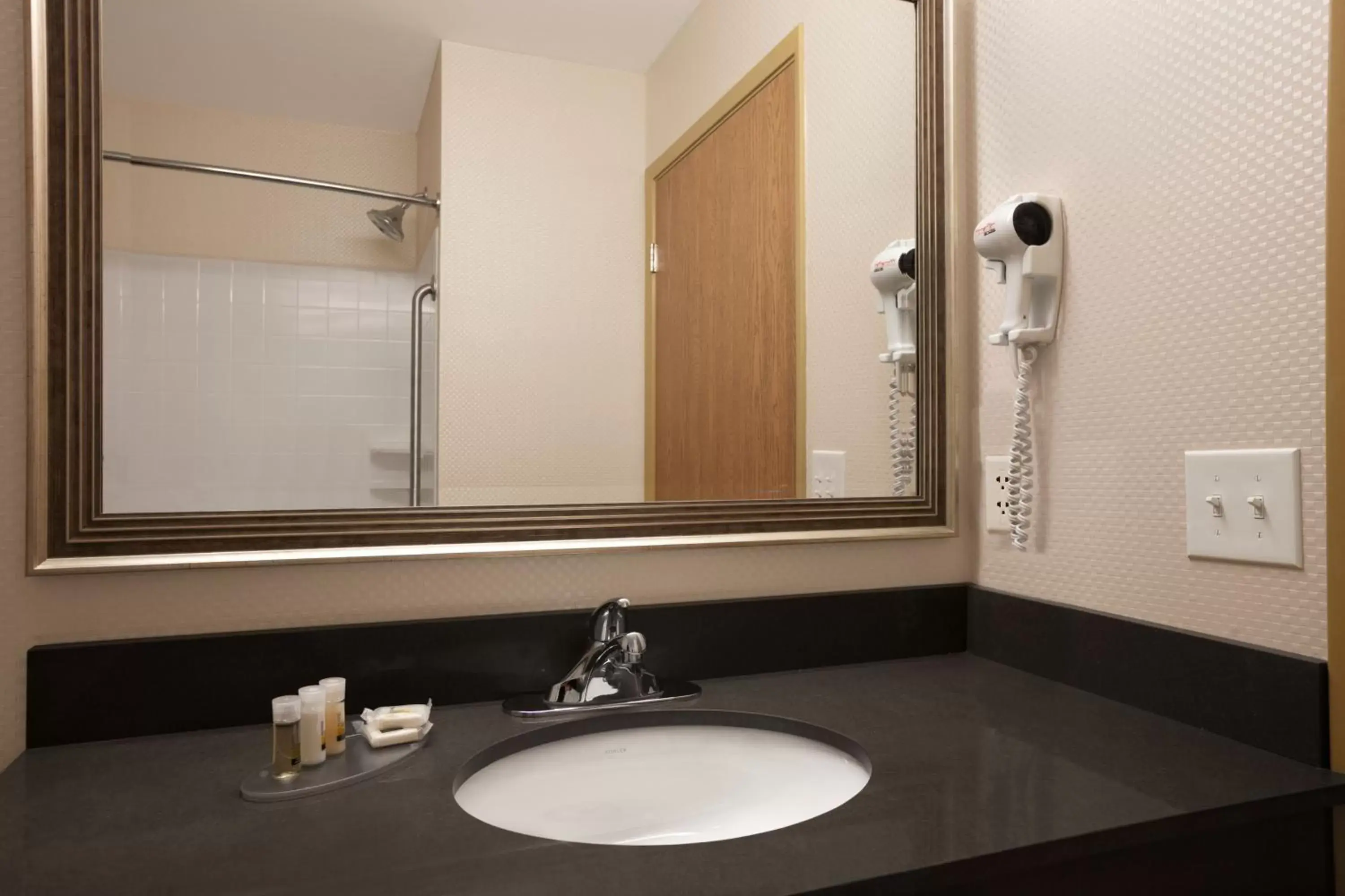 Bathroom in Days Inn & Suites by Wyndham Winnipeg Airport Manitoba