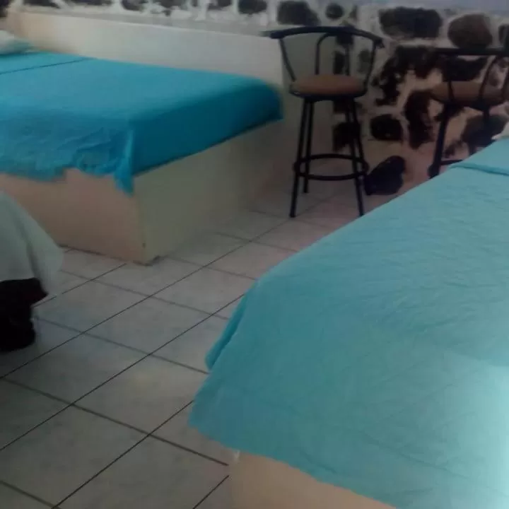 Bed in Hostal Cabañas Don Jorge