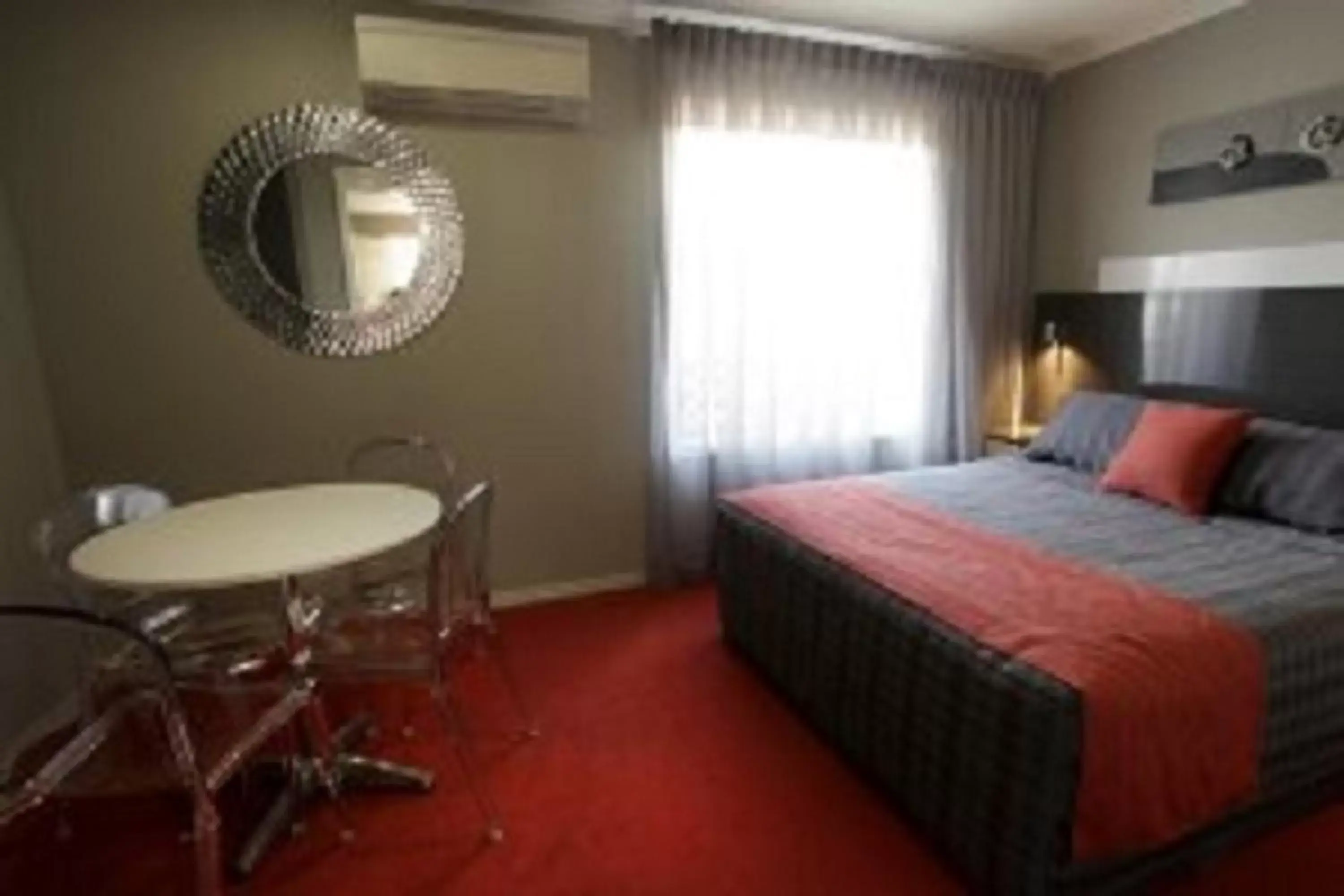 Bedroom in Cattlemans Country Motor Inn & Serviced Apartments