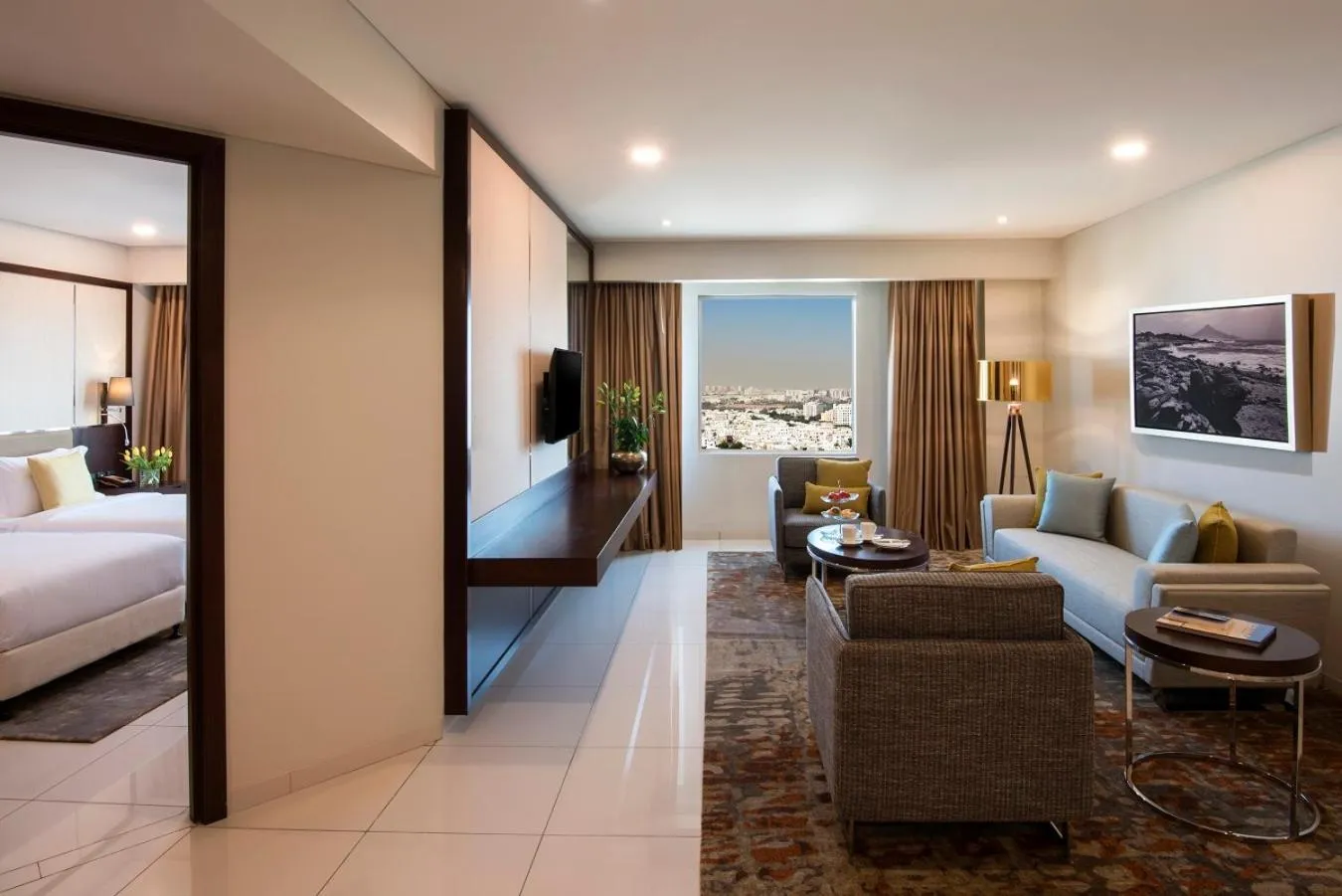 Living room, Bed in Fraser Suites Muscat