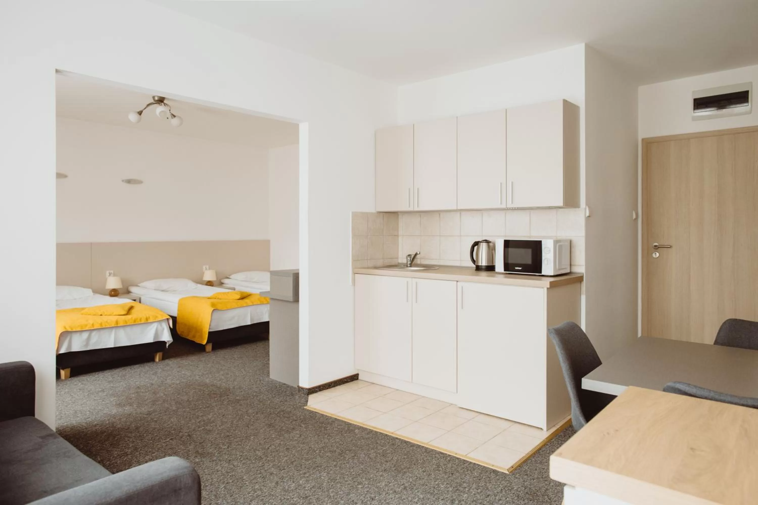 Kitchen or kitchenette, Bed in Arche Hotel Siedlce