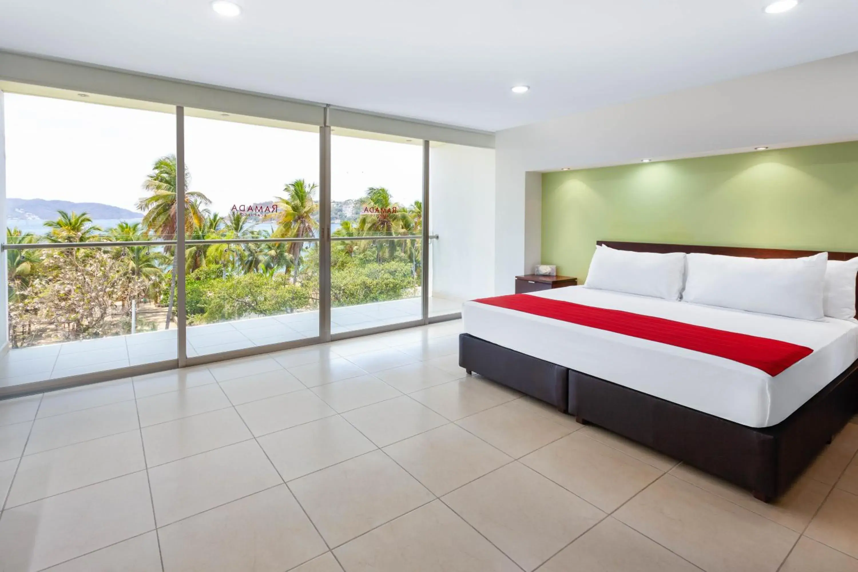 Bedroom, Bed in Ramada by Wyndham Acapulco Hotel & Suites
