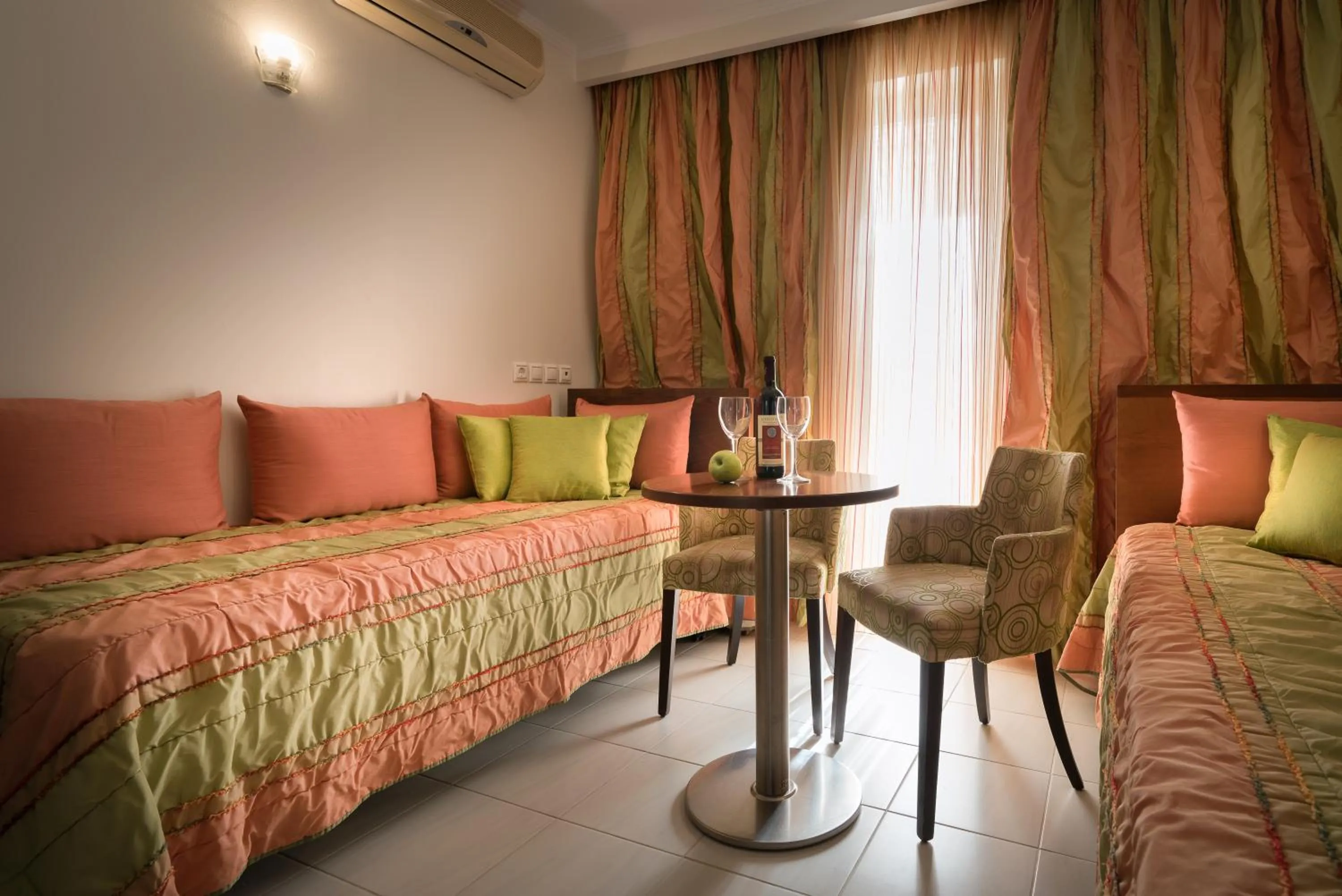 Seating area, Bed in Galaxy Beach Resort BW Premier Collection