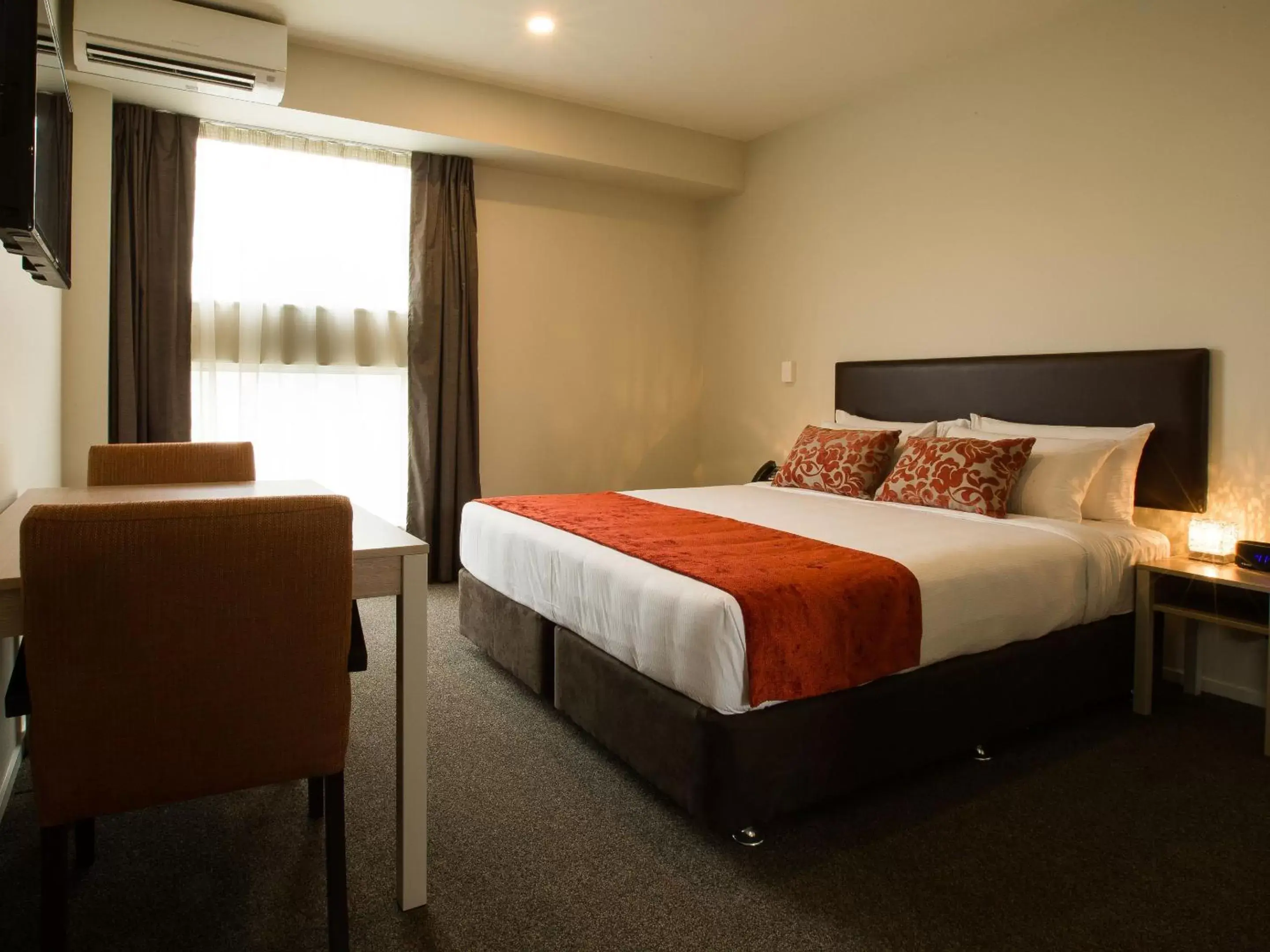 Bed in Ramada Suites by Wyndham Christchurch City