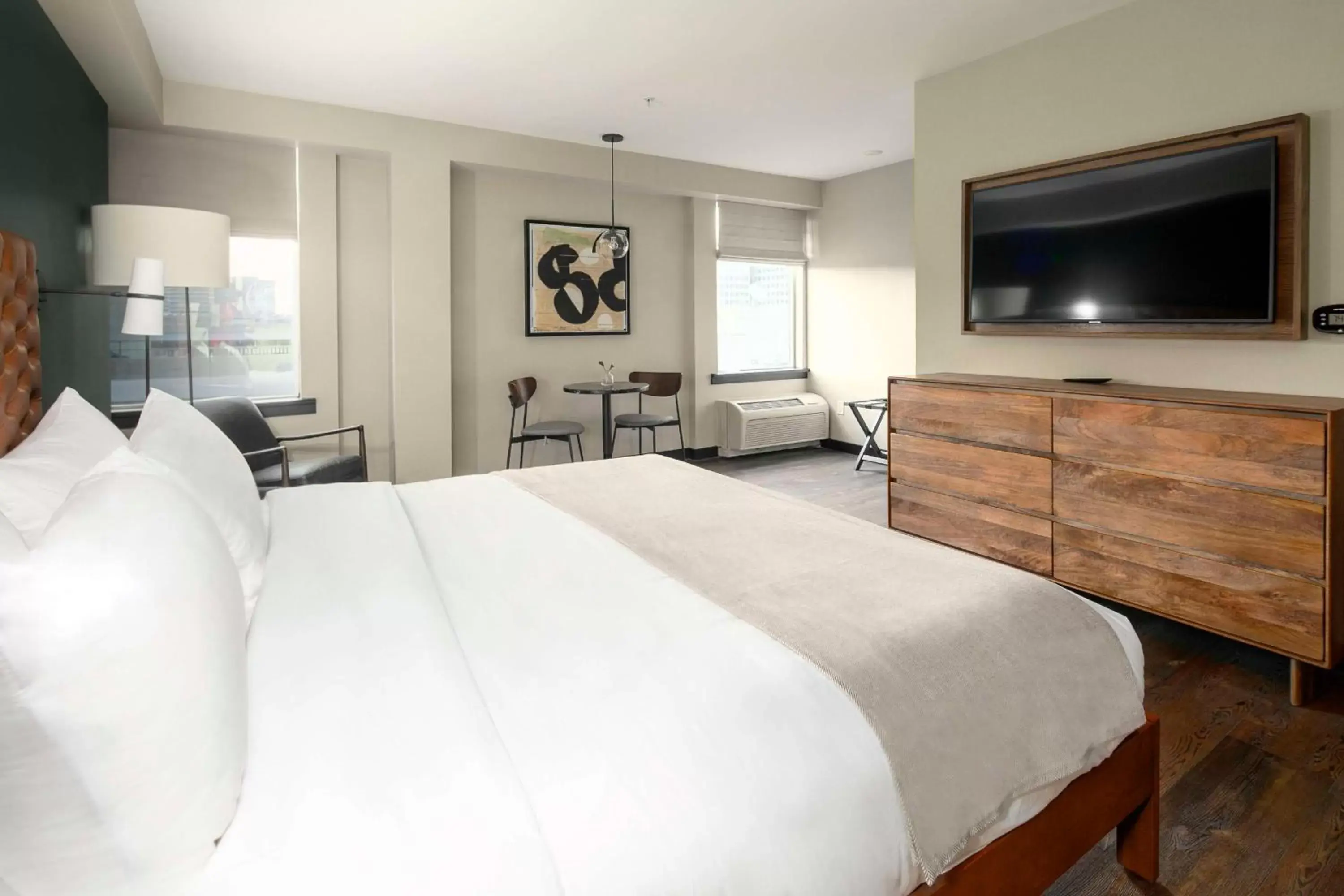 Living room, Bed in The Lloyd Stamford, Tapestry Collection by Hilton Living room, Bed in The Lloyd Stamford, Tapestry Collection by Hilton