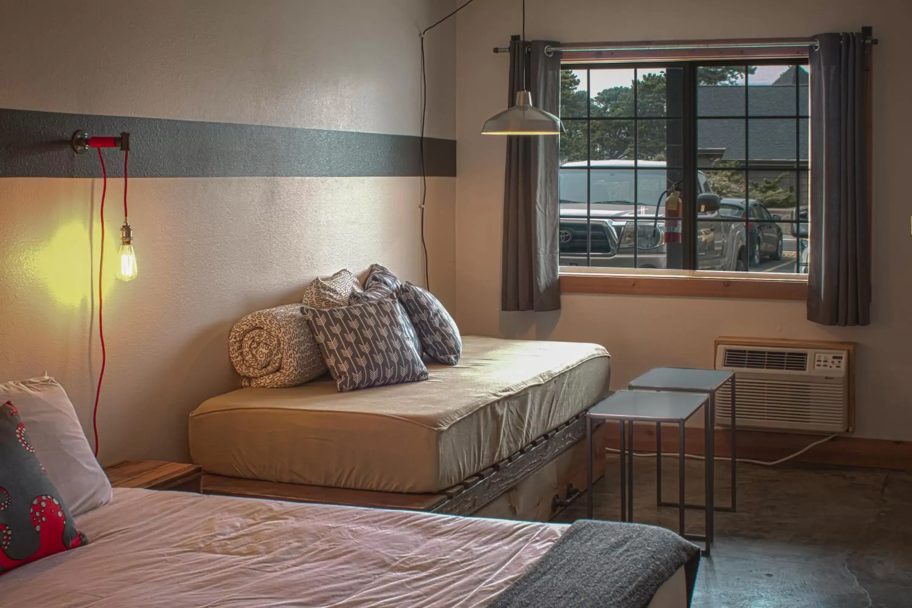 Bed, Seating Area in Ashore Hotel