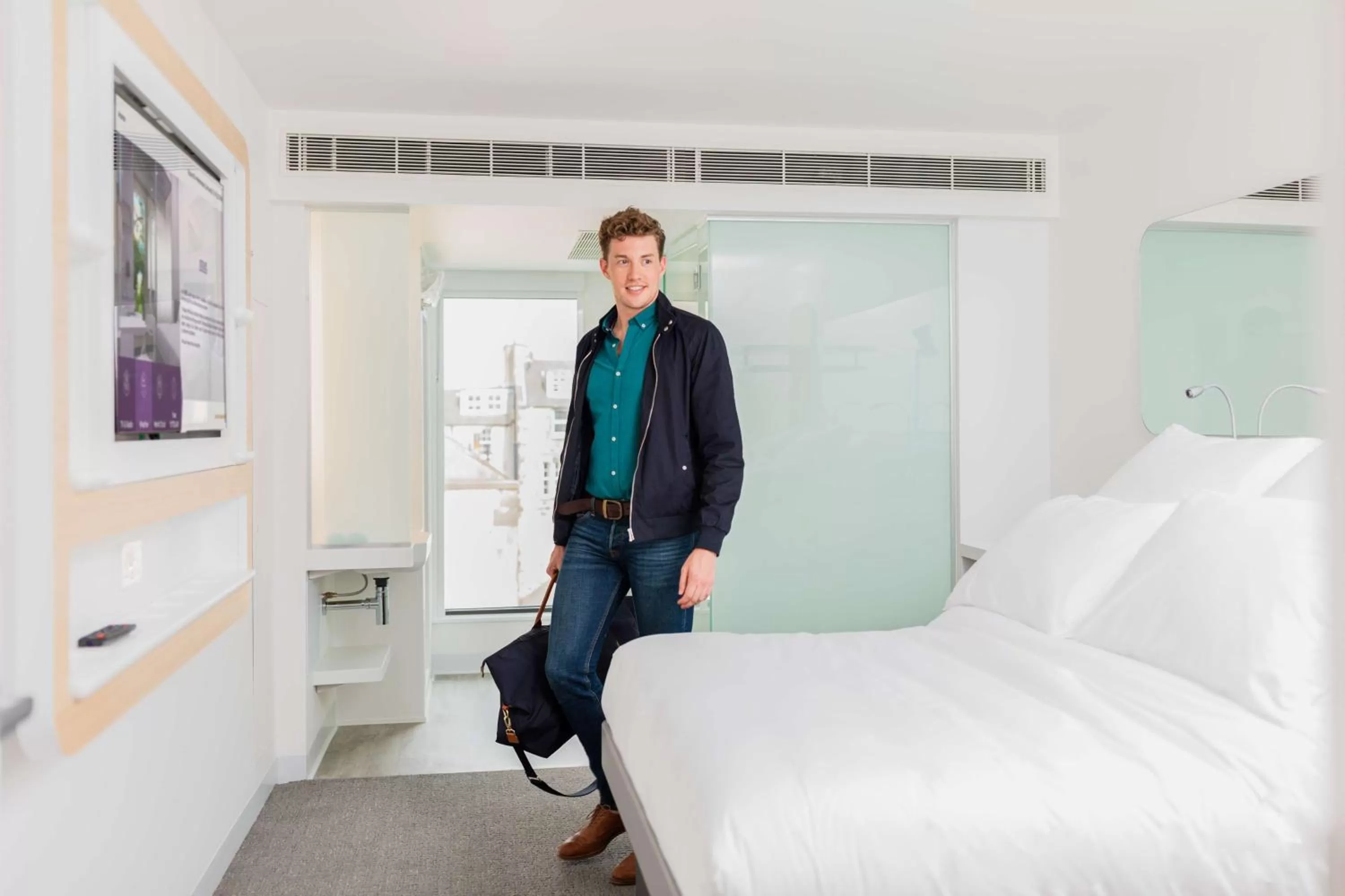 Photo of the whole room, Bed in YOTEL Edinburgh