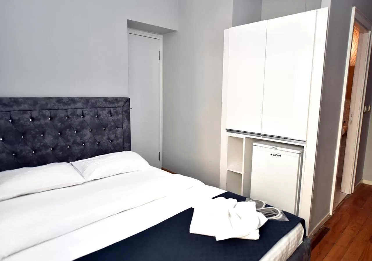 Bed in Royal Palace Hotel