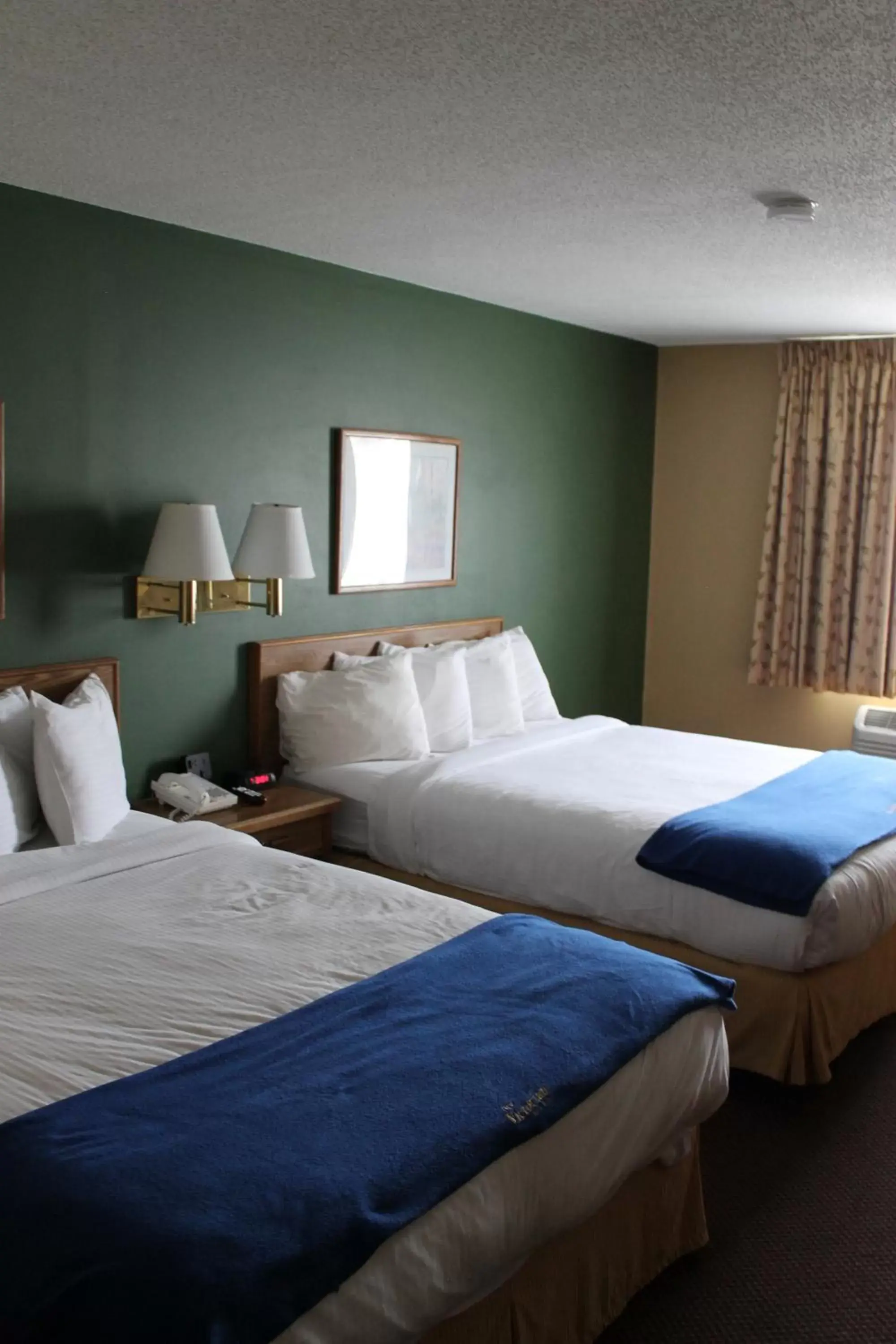 Bed in New Victorian Inn & Suites Kearney