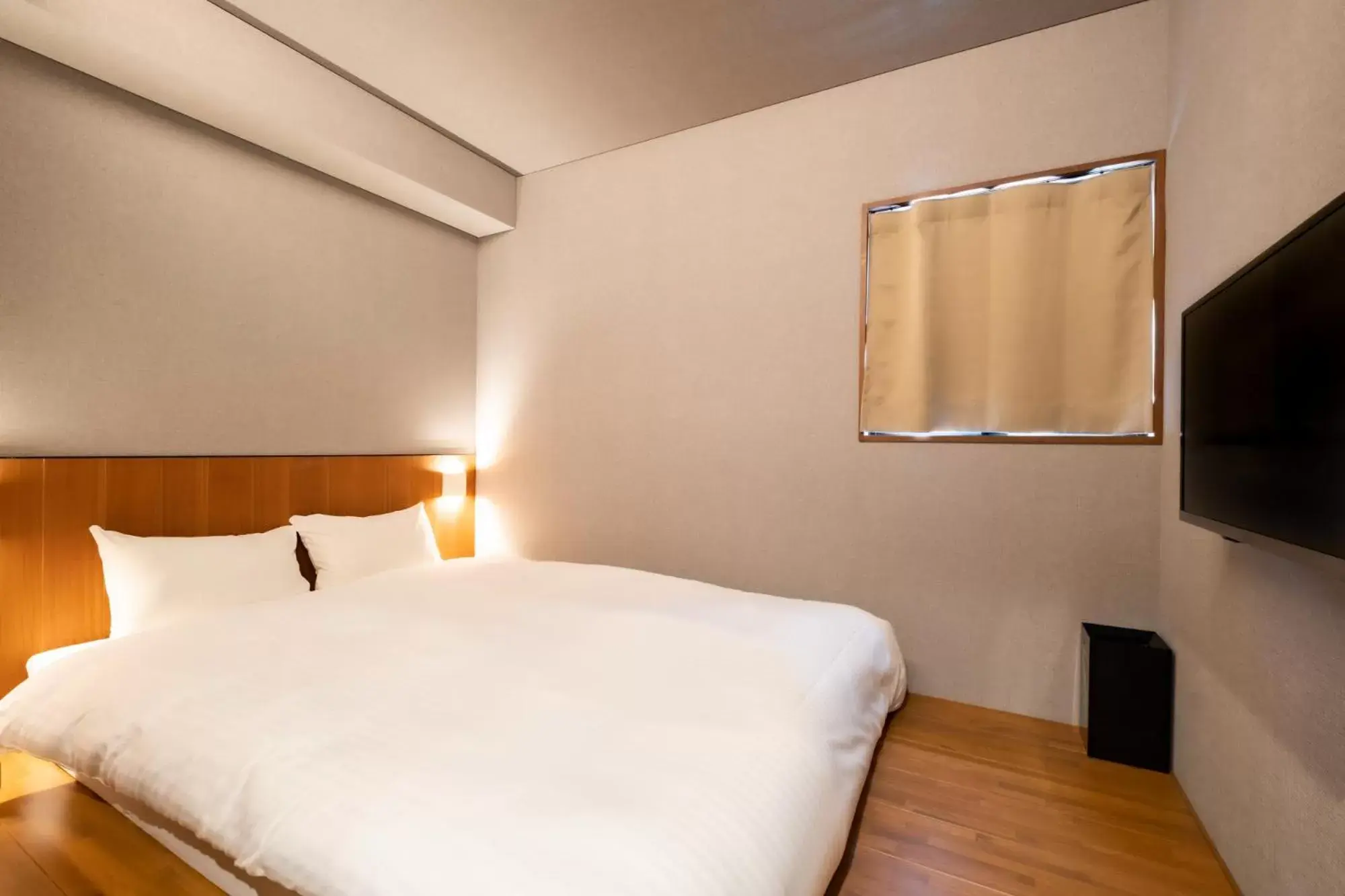 Bed in &HOTEL HAKATA