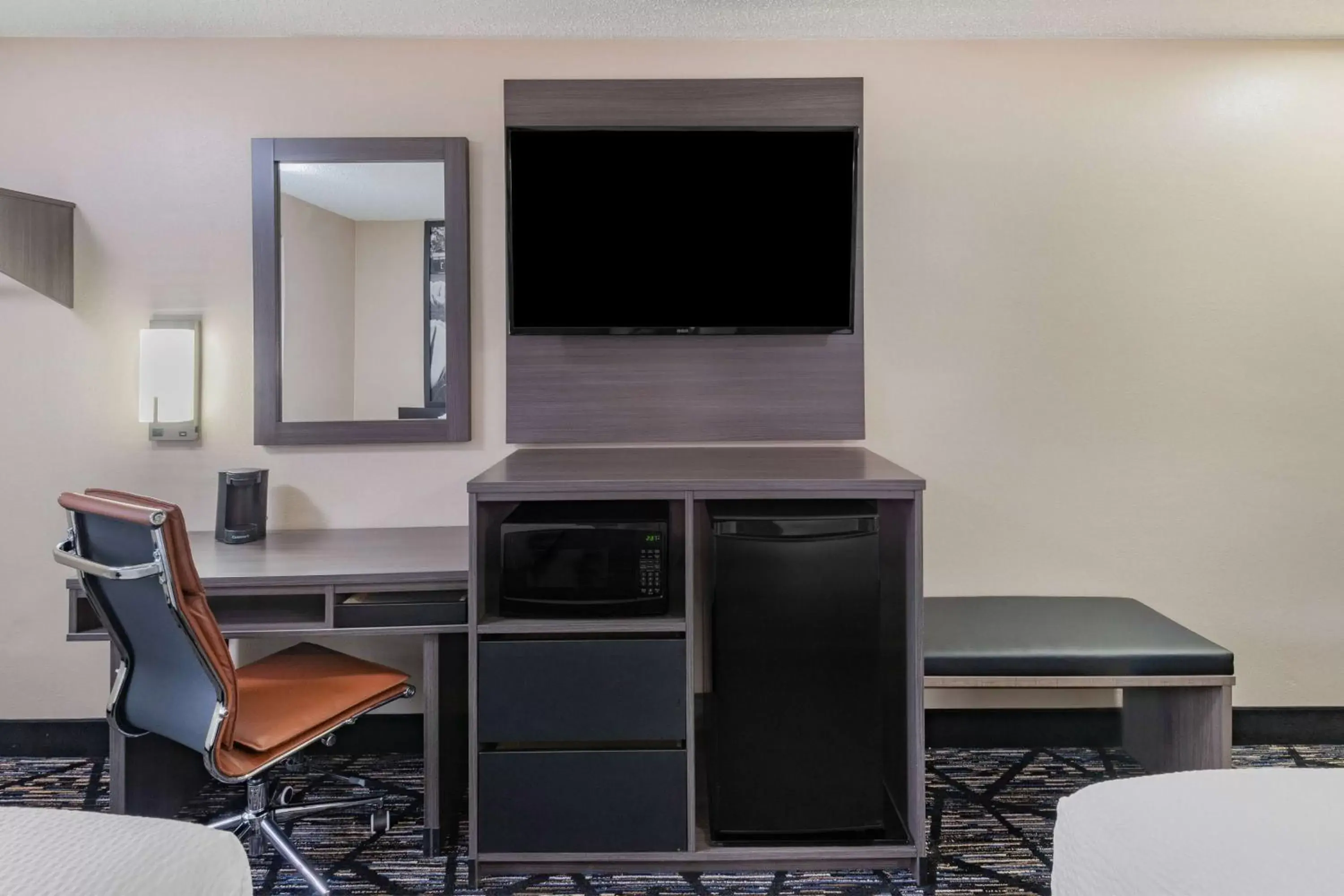 Photo of the whole room, TV/Entertainment Center in Super 8 by Wyndham Charlottesville