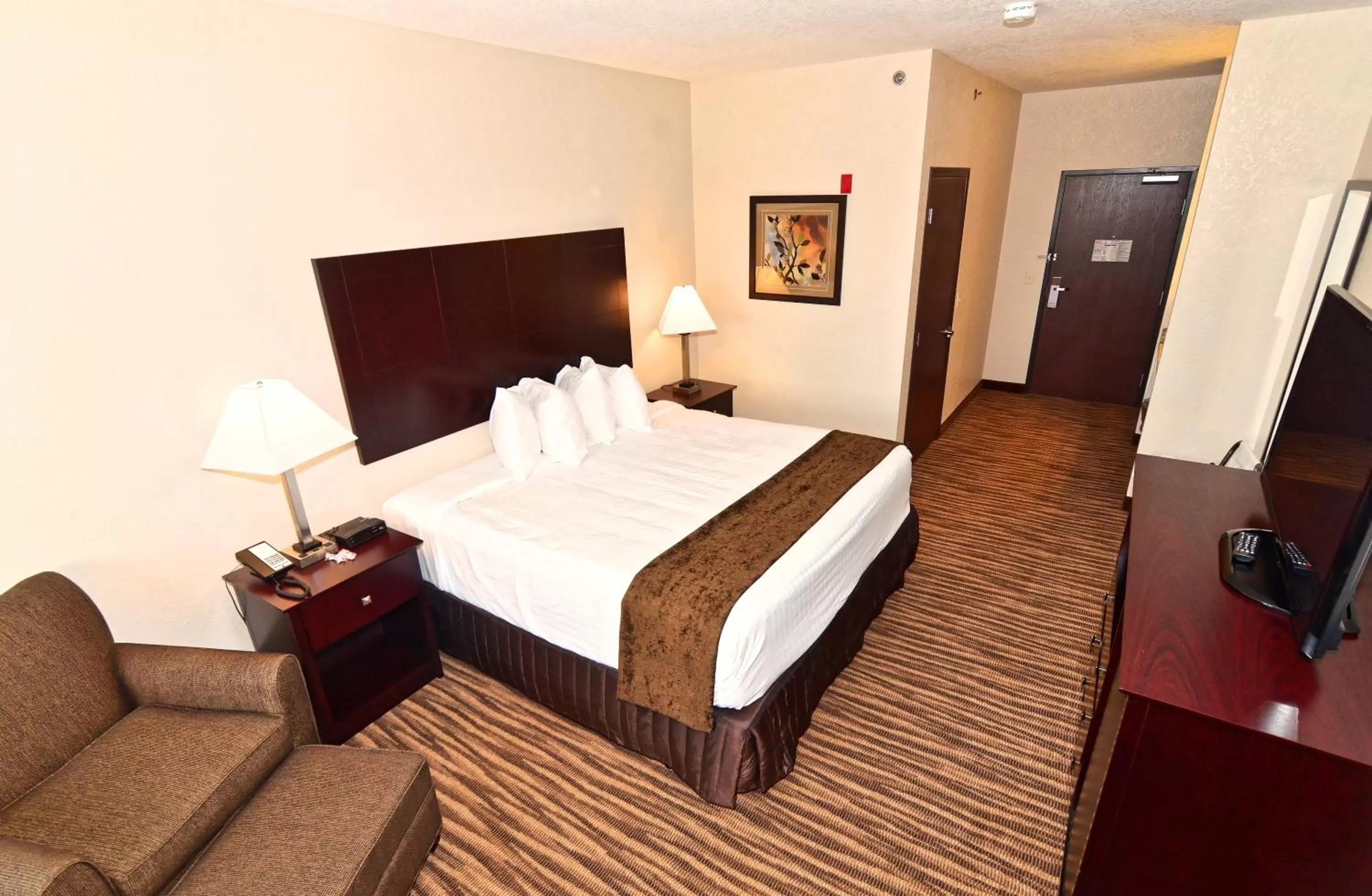 Bed in Cobblestone Inn & Suites - Clarion