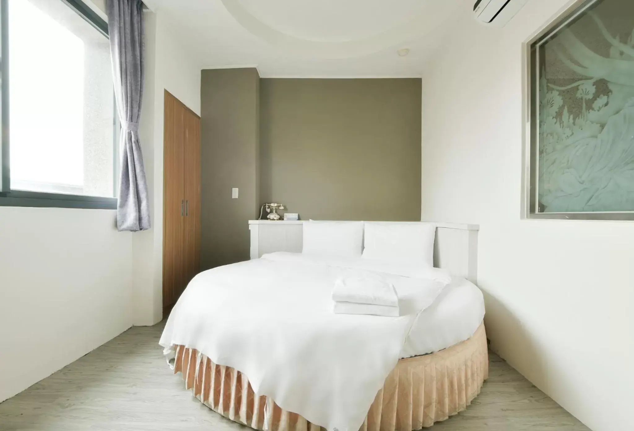 Bed in Raise Hotel Taichung