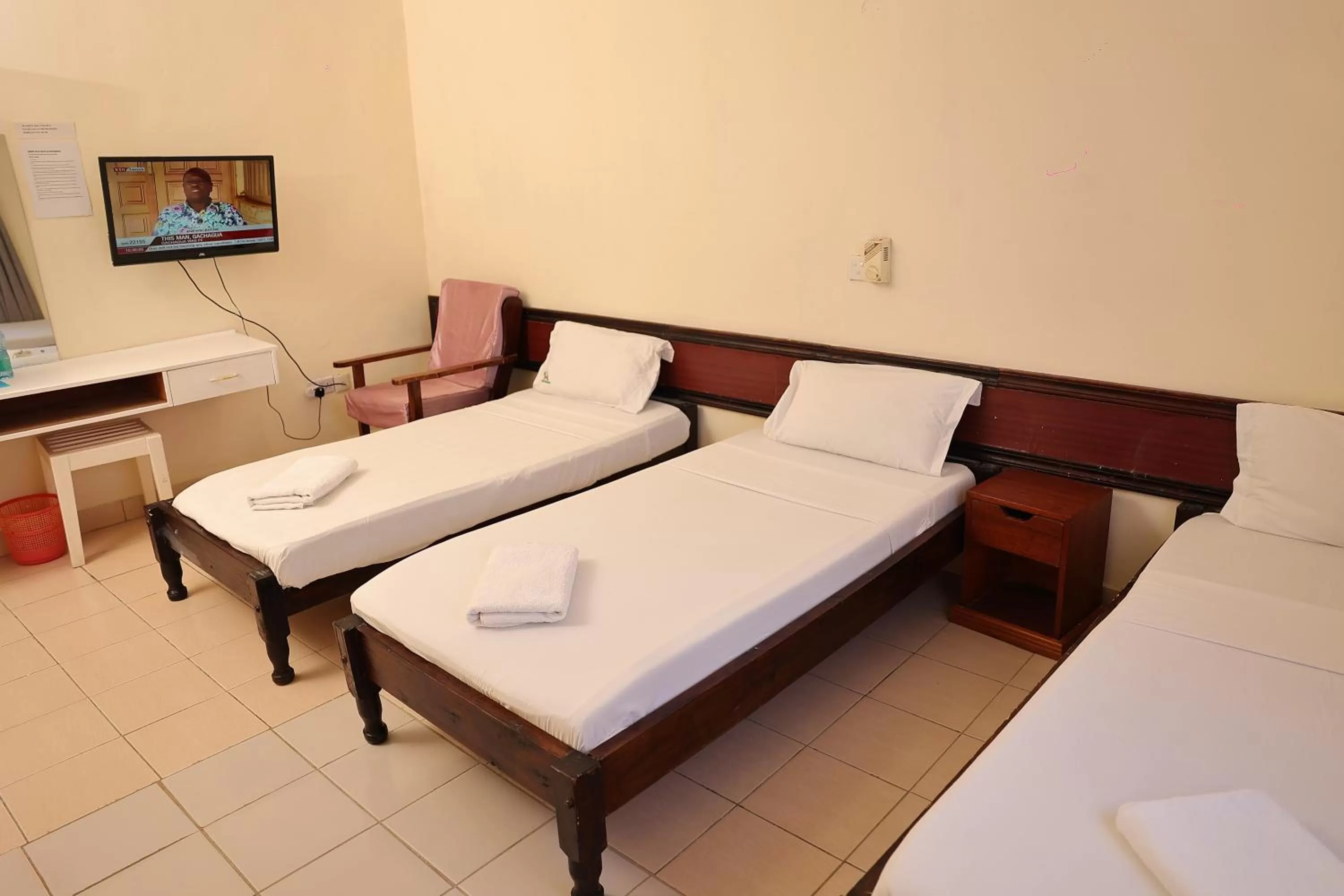 Bed in Merry Villa Hotel & Apartments