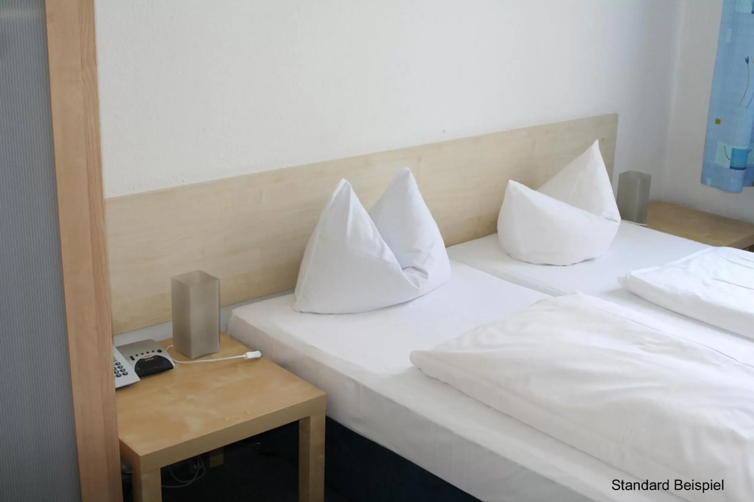 Bed in Hotel Seifert Berlin am Kurfürstendamm