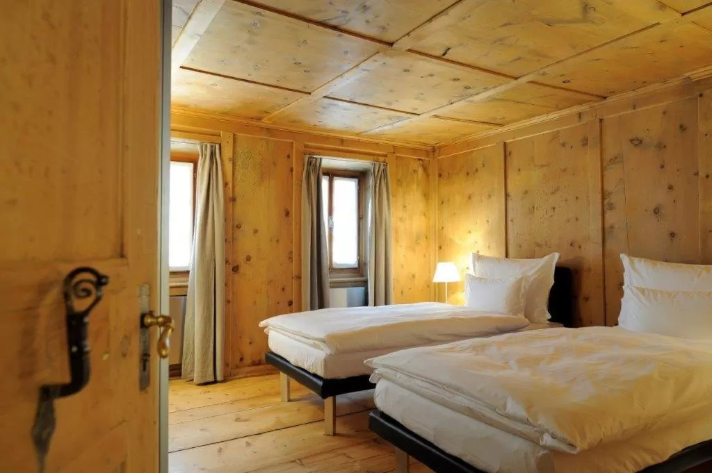 Bed in Hotel Müller - mountain lodge