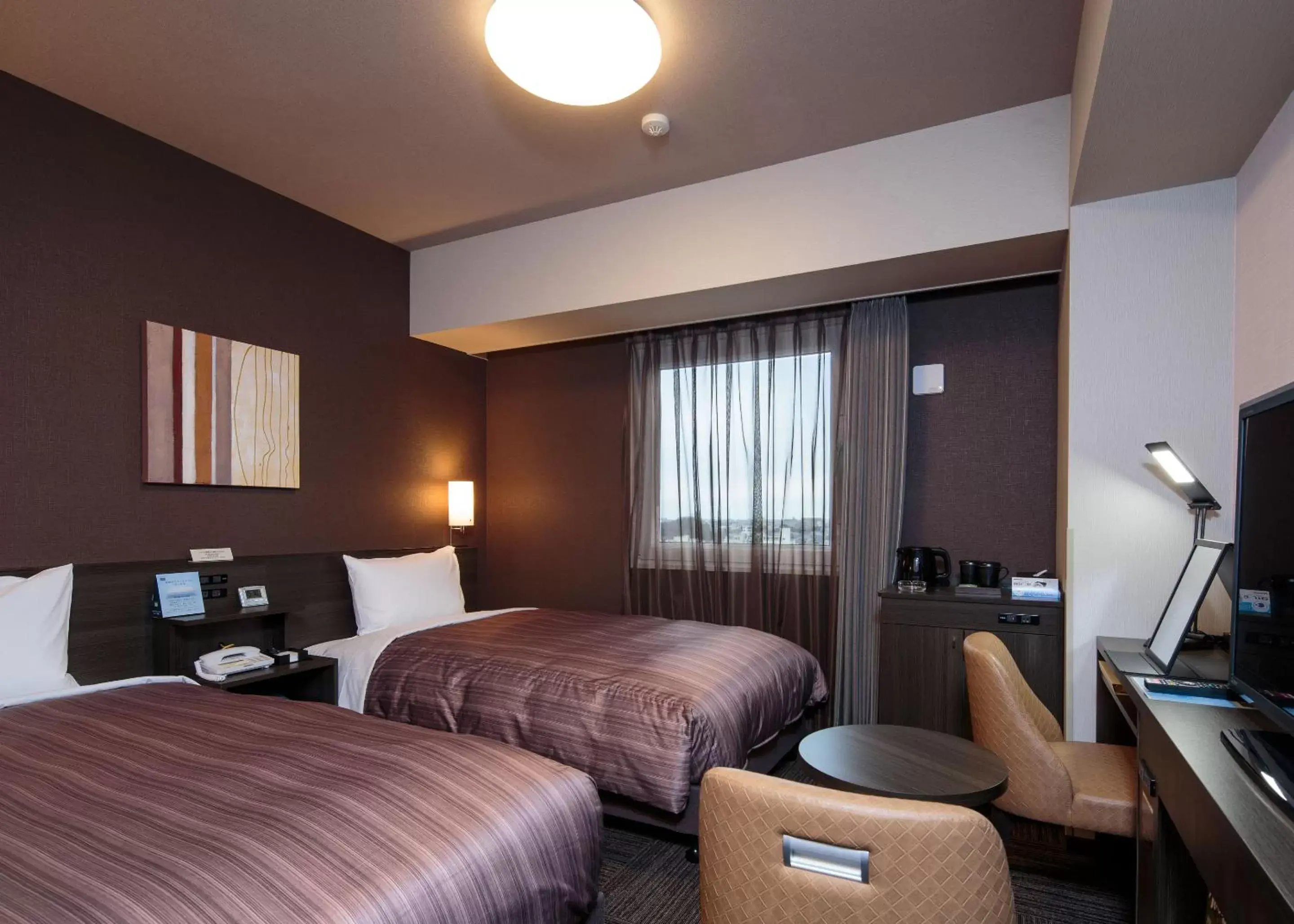 Bed in Hotel Route-Inn Takaoka Ekimae