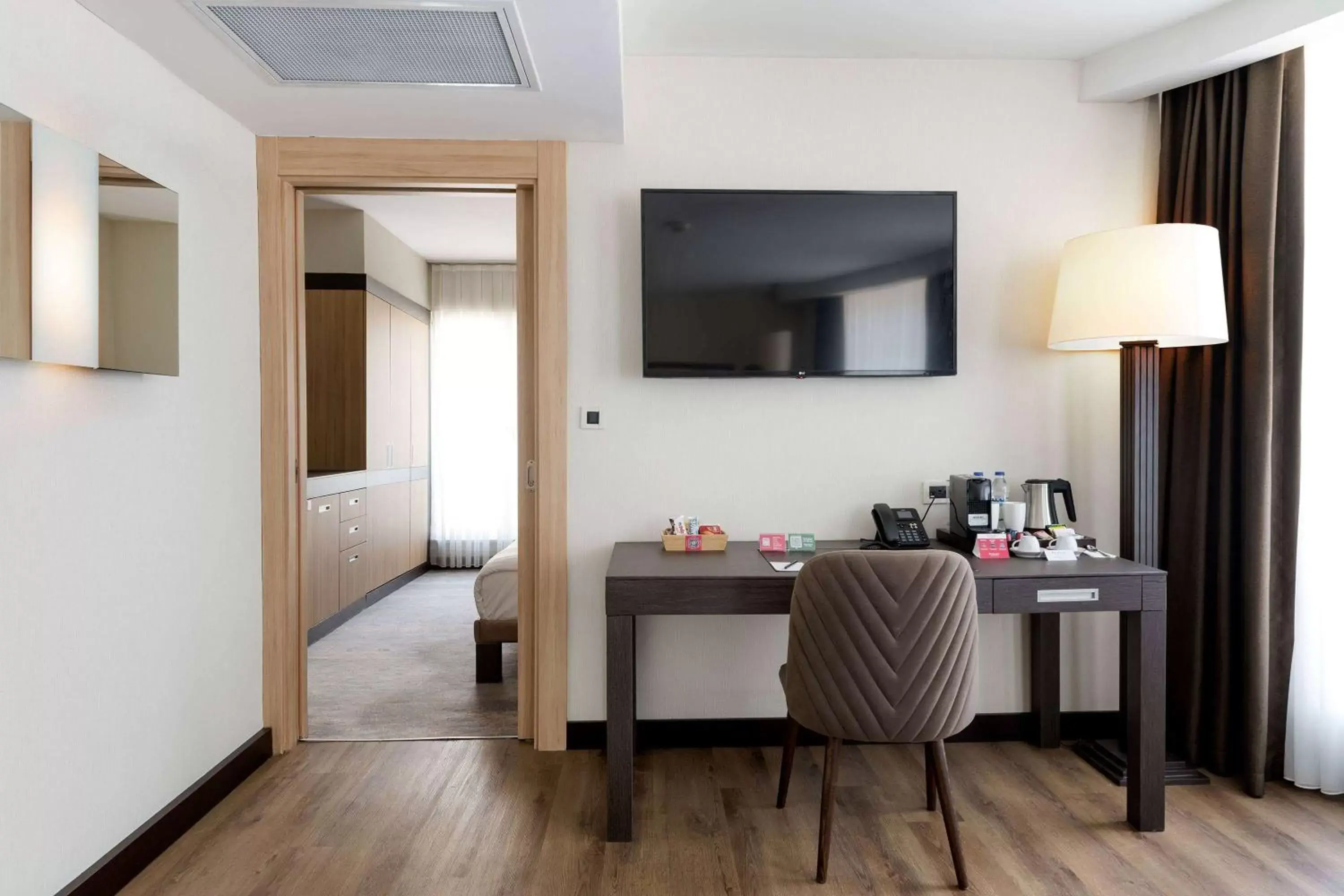 Photo of the whole room, TV/Entertainment Center in Ramada Plaza By Wyndham Istanbul City Center