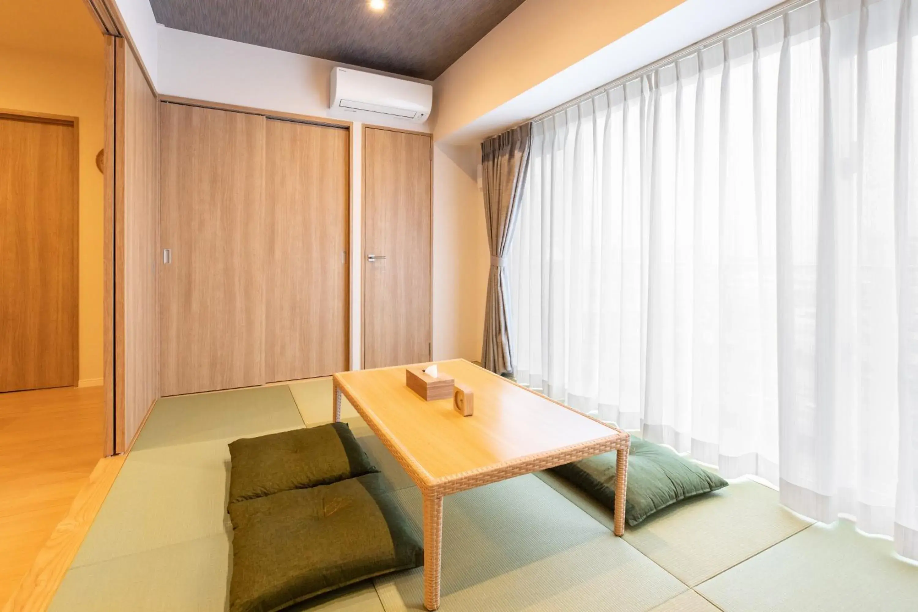 Photo of the whole room, Seating Area in LAPIN MIHAMA Residence Hotel